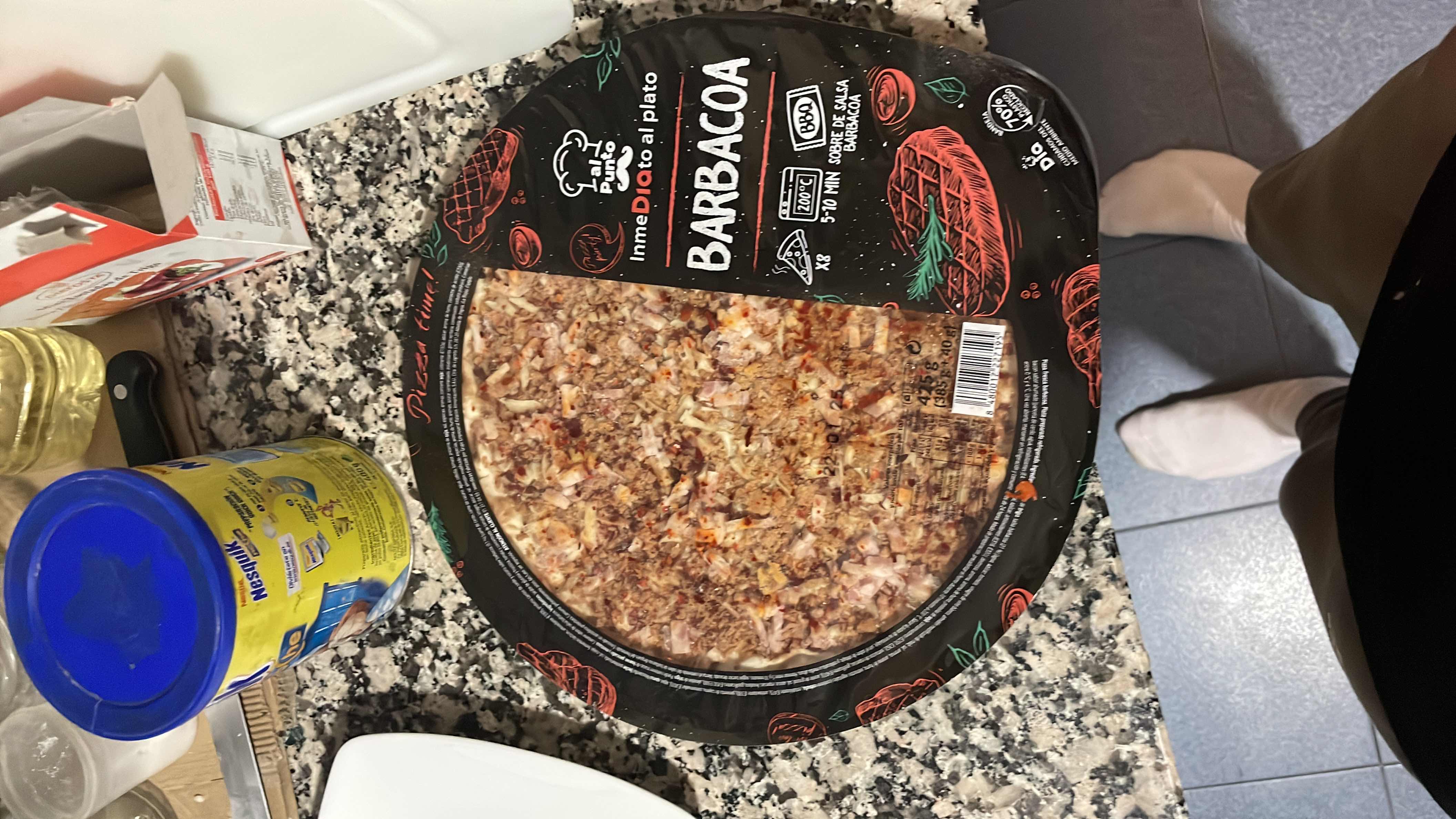 A pre-packaged barbacoa-flavored pizza with a mix of cheese, ham, and barbecue sauce, designed for quick preparation.