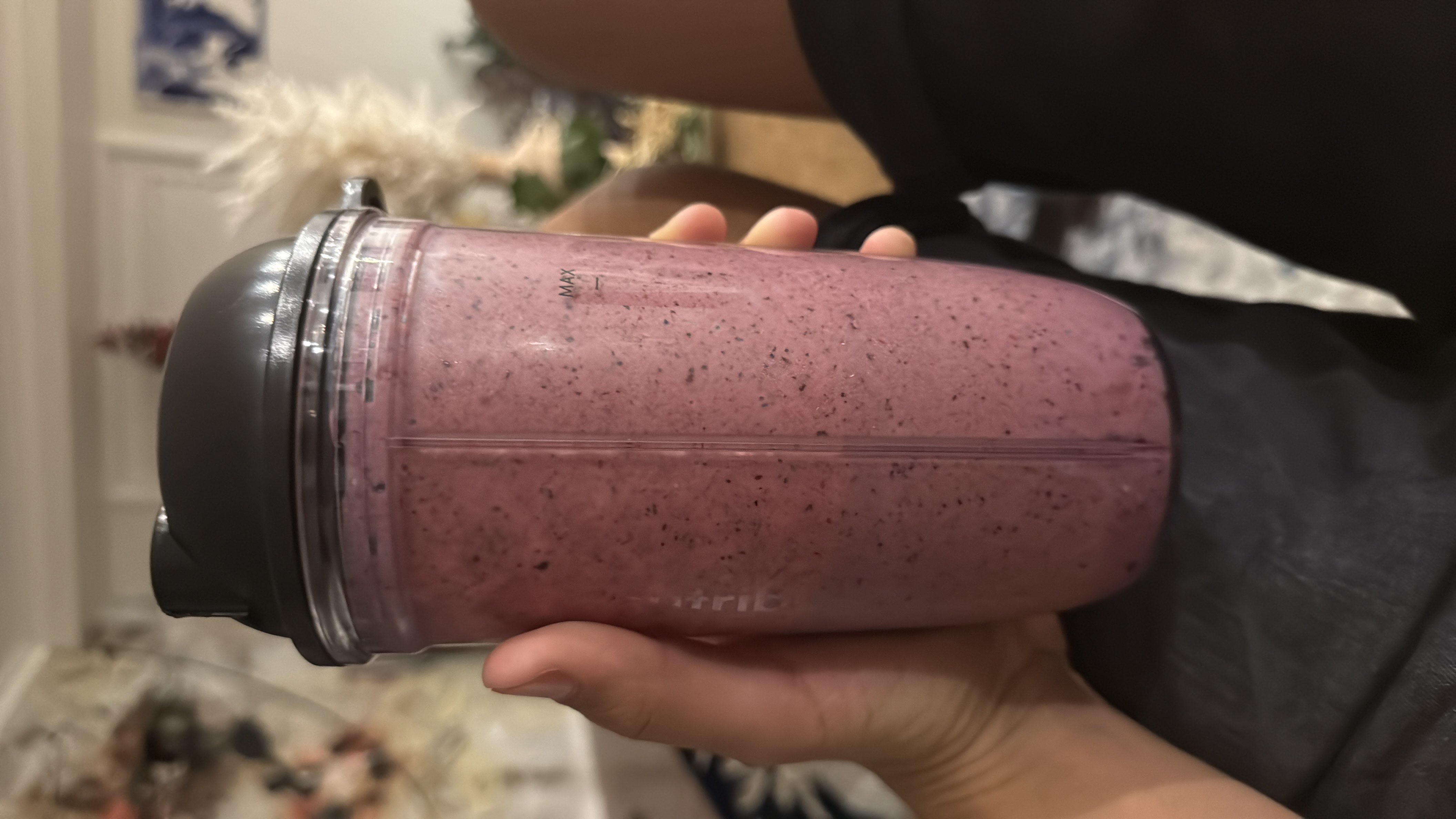 A nutritious berry smoothie made with blueberries, banana, and Greek yogurt, providing a balanced mix of protein, carbs, and fats.