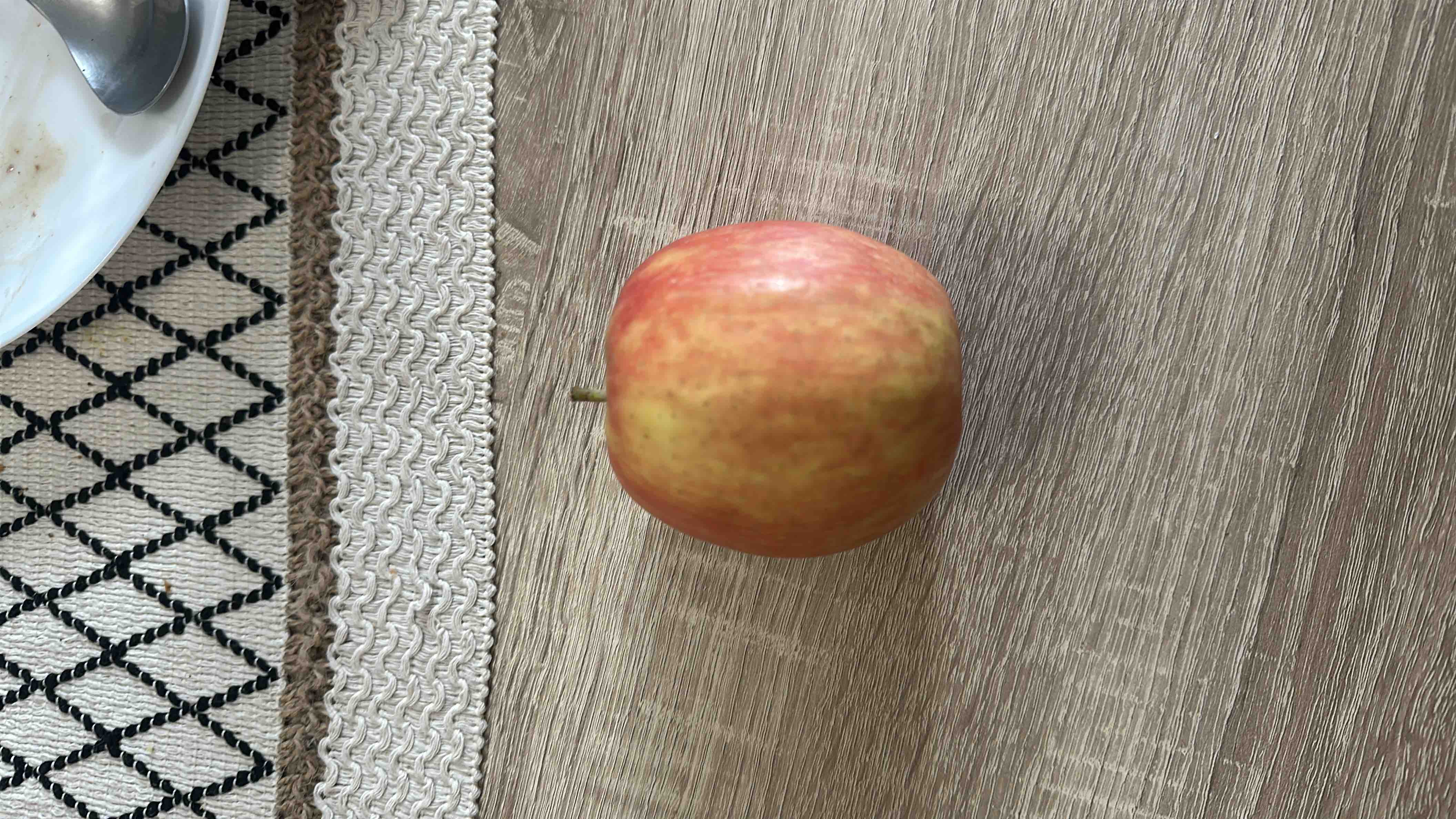 The image shows a single apple, which is a nutritious fruit rich in carbohydrates and low in fats and protein.