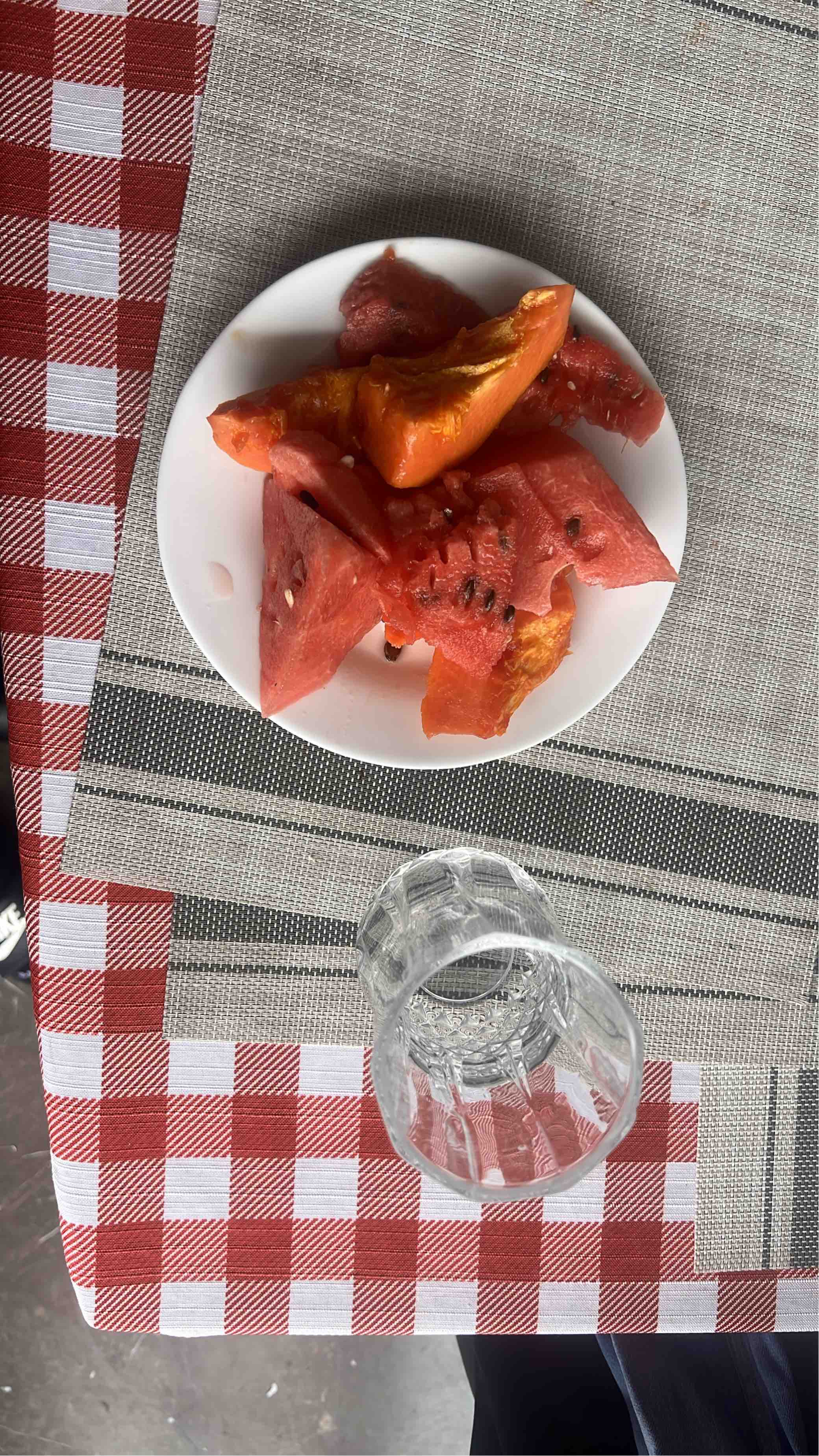 A plate of fresh watermelon and papaya slices with a 30g scoop of collagen, low in calories and rich in hydration and nutrients.