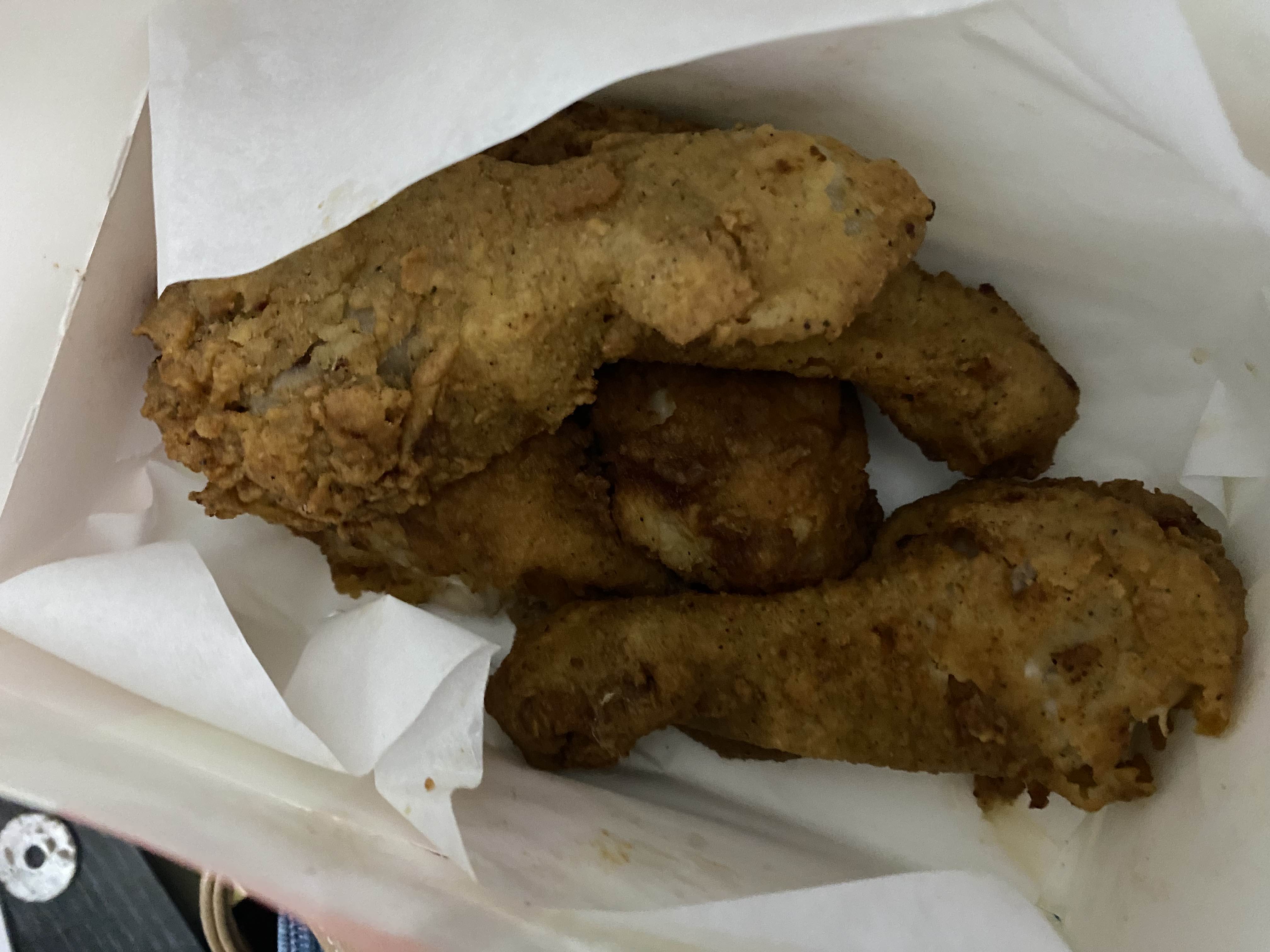 A serving of fried chicken drumsticks, high in protein and fats with moderate carbohydrates.