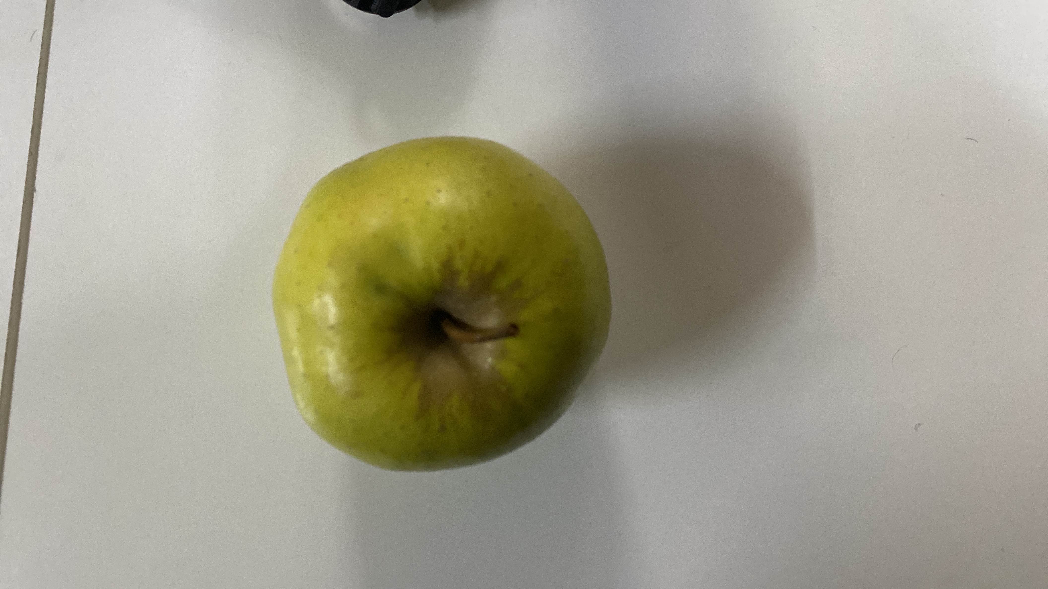 The image shows a single apple, which is a nutritious fruit rich in carbohydrates and low in fats and protein.