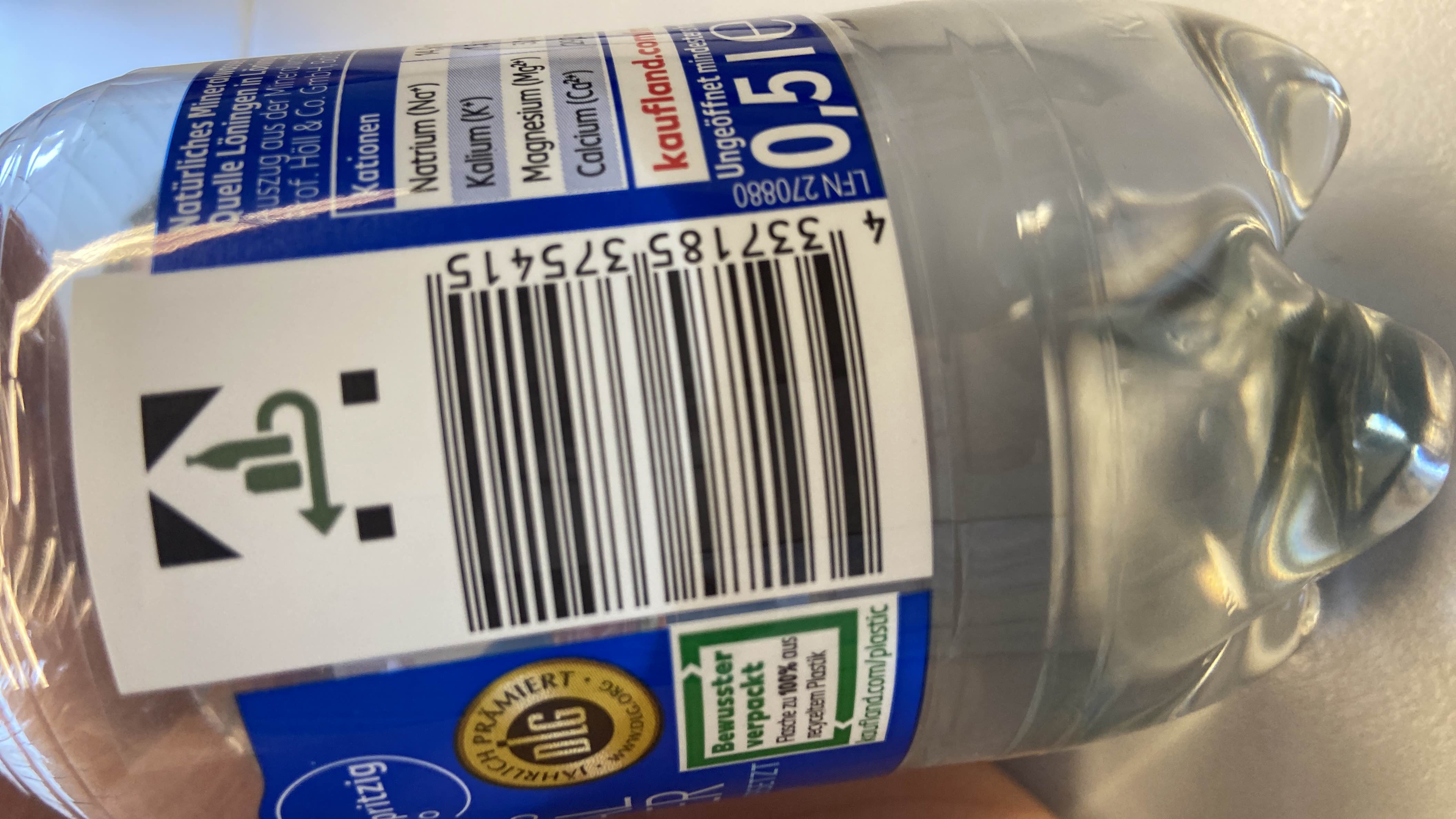 This is a bottle of natural mineral water with no calories, fats, proteins, or carbohydrates. It is packaged in 100% recycled plastic.