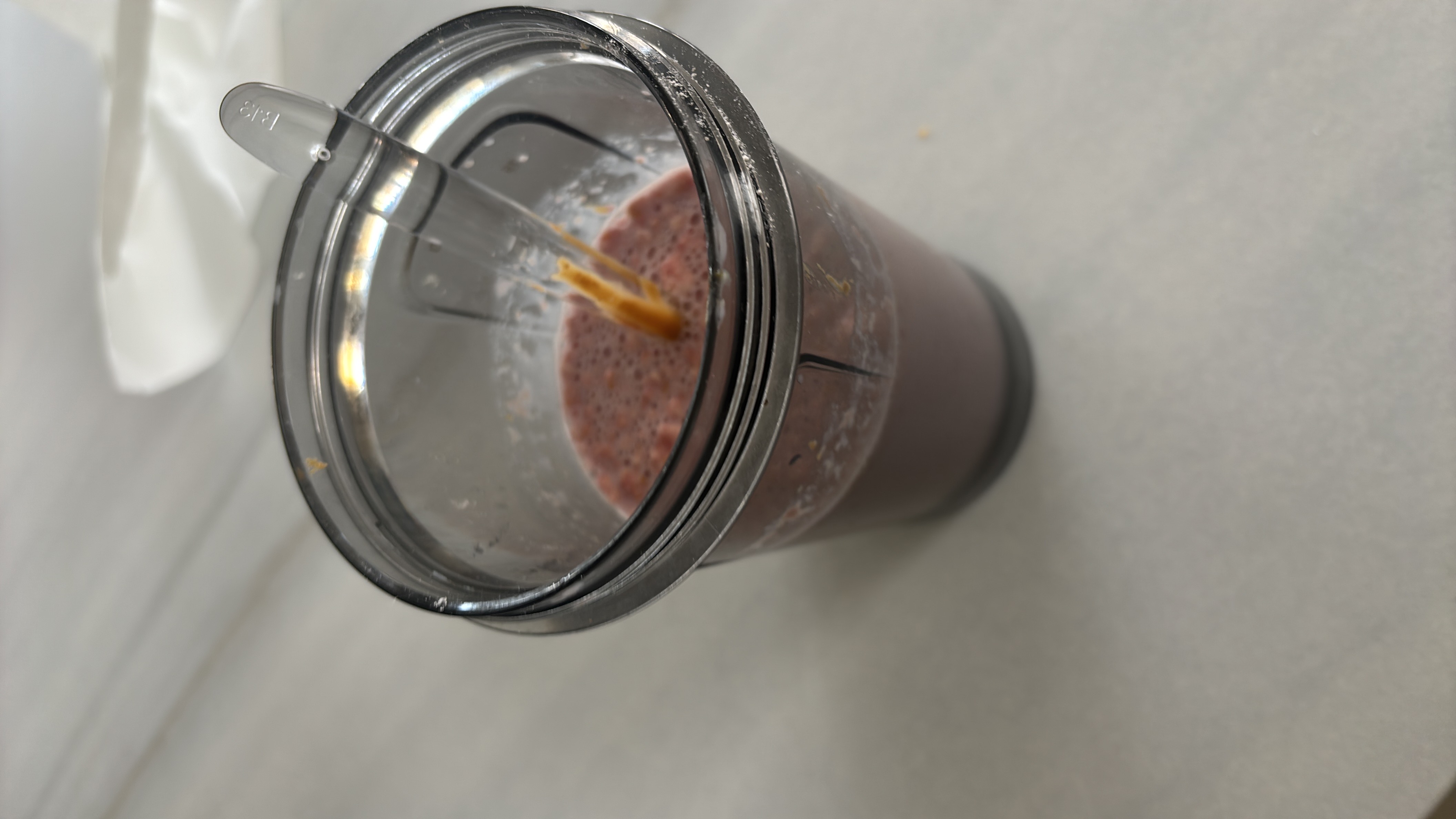 A nutritious smoothie made with banana, peanut butter, and milk, providing a balanced mix of protein, carbs, and fats.