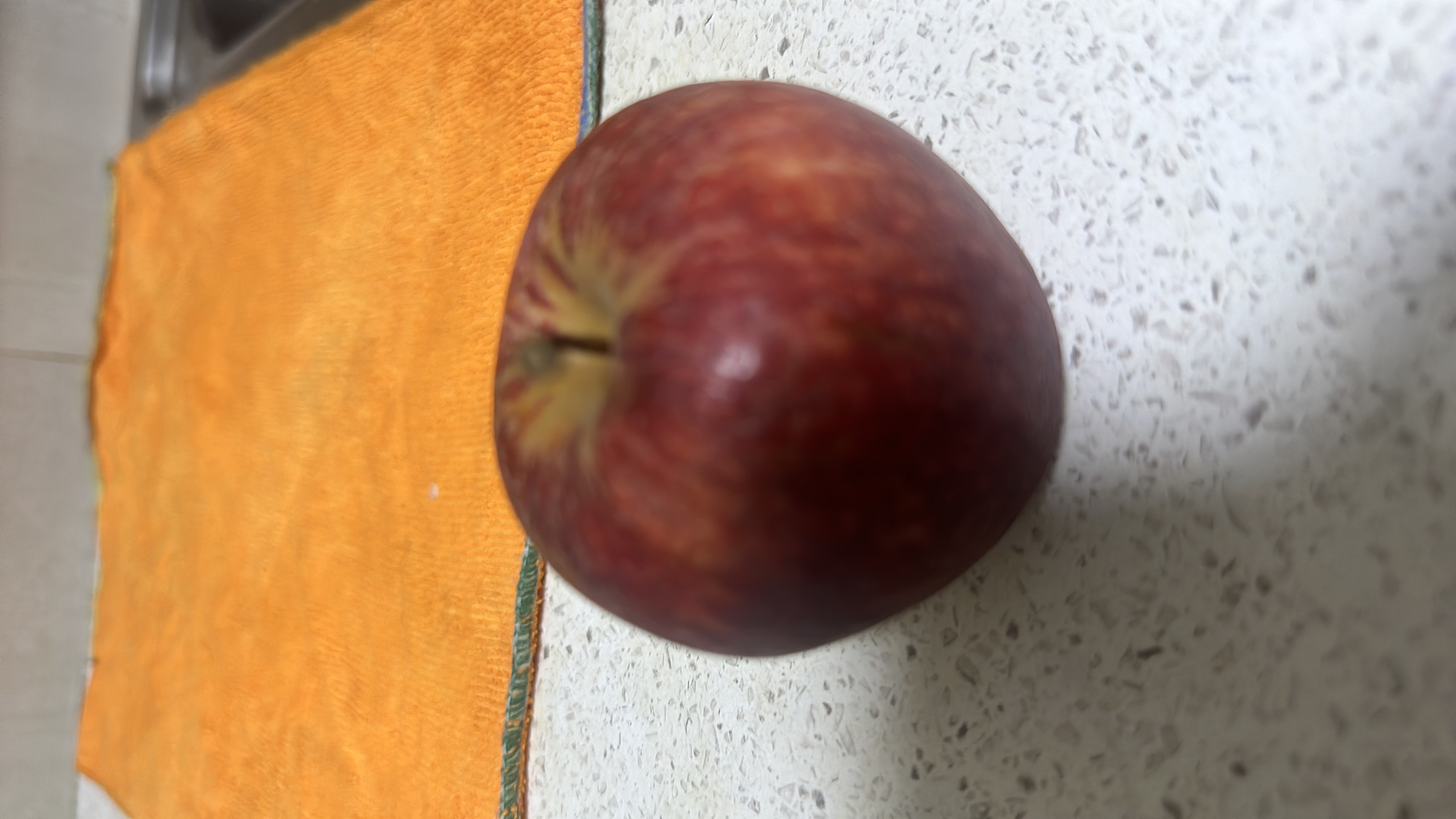 The image shows a red apple, which is a nutritious fruit rich in carbohydrates and low in fats and protein.
