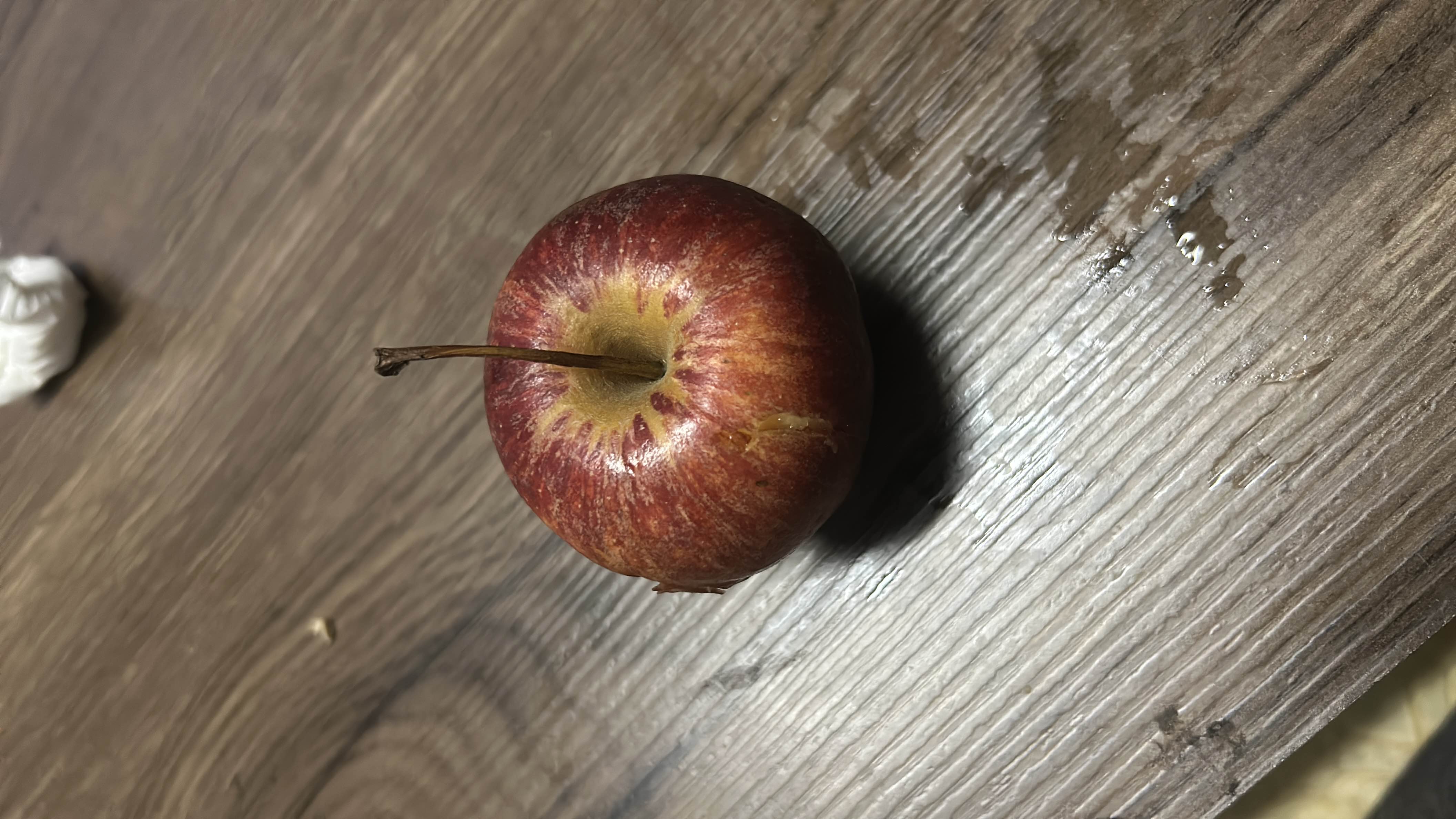 The image shows a fresh apple, which is a nutritious fruit rich in carbohydrates and low in fats and protein.