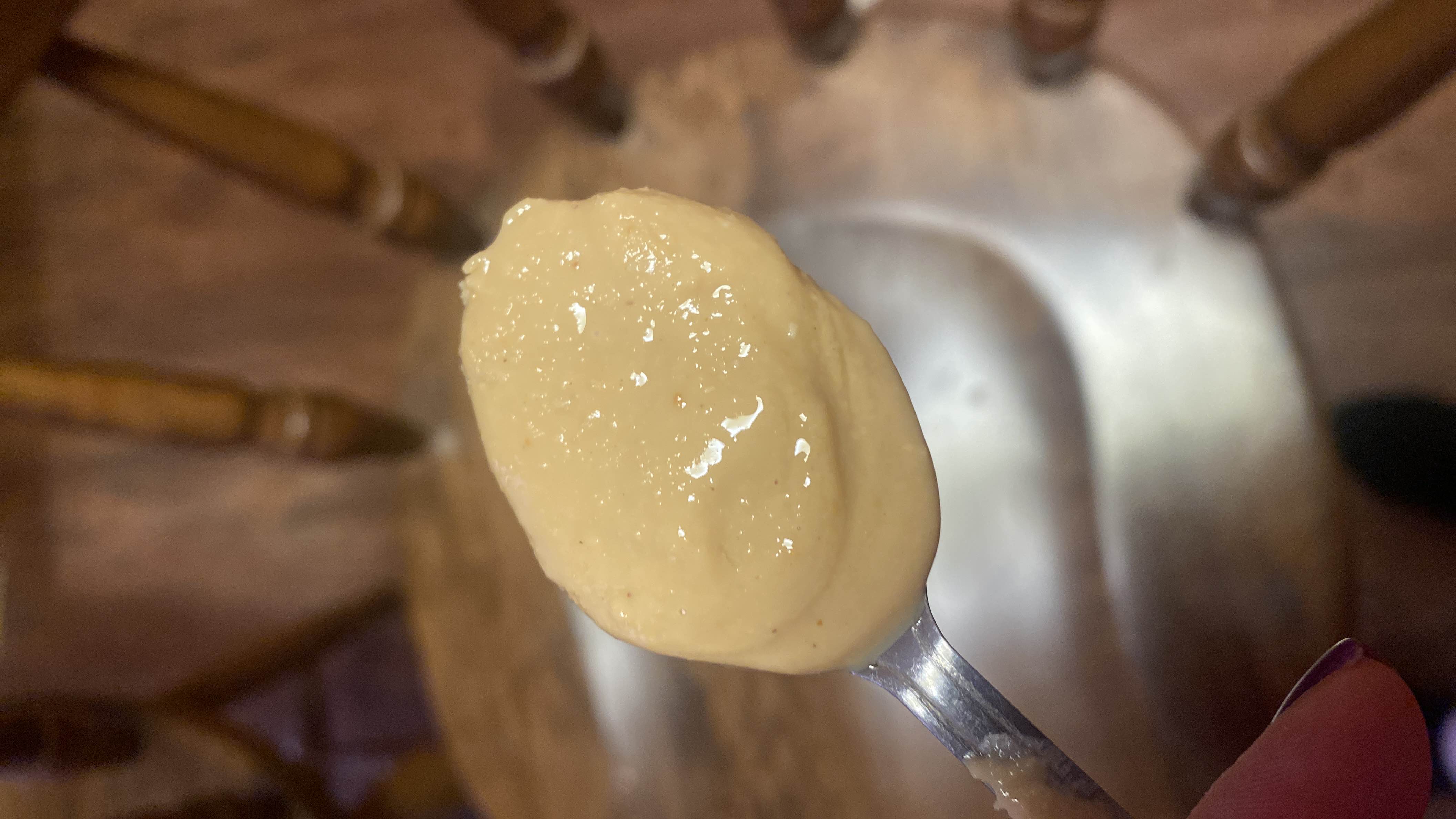 A spoonful of creamy peanut butter, a nutrient-dense spread high in healthy fats and protein.