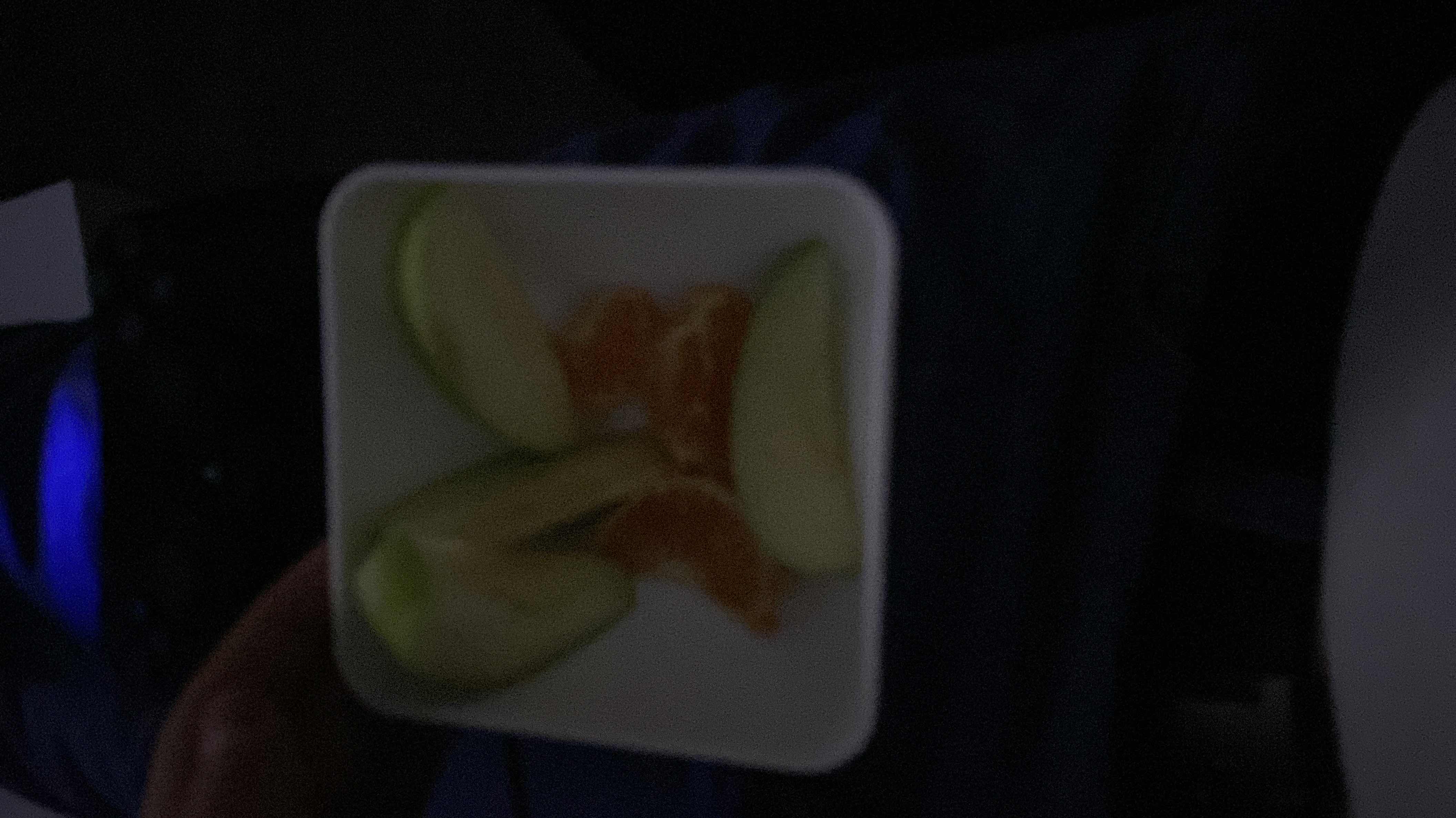 A small serving of fresh apple and orange slices, providing a healthy and low-calorie snack option.