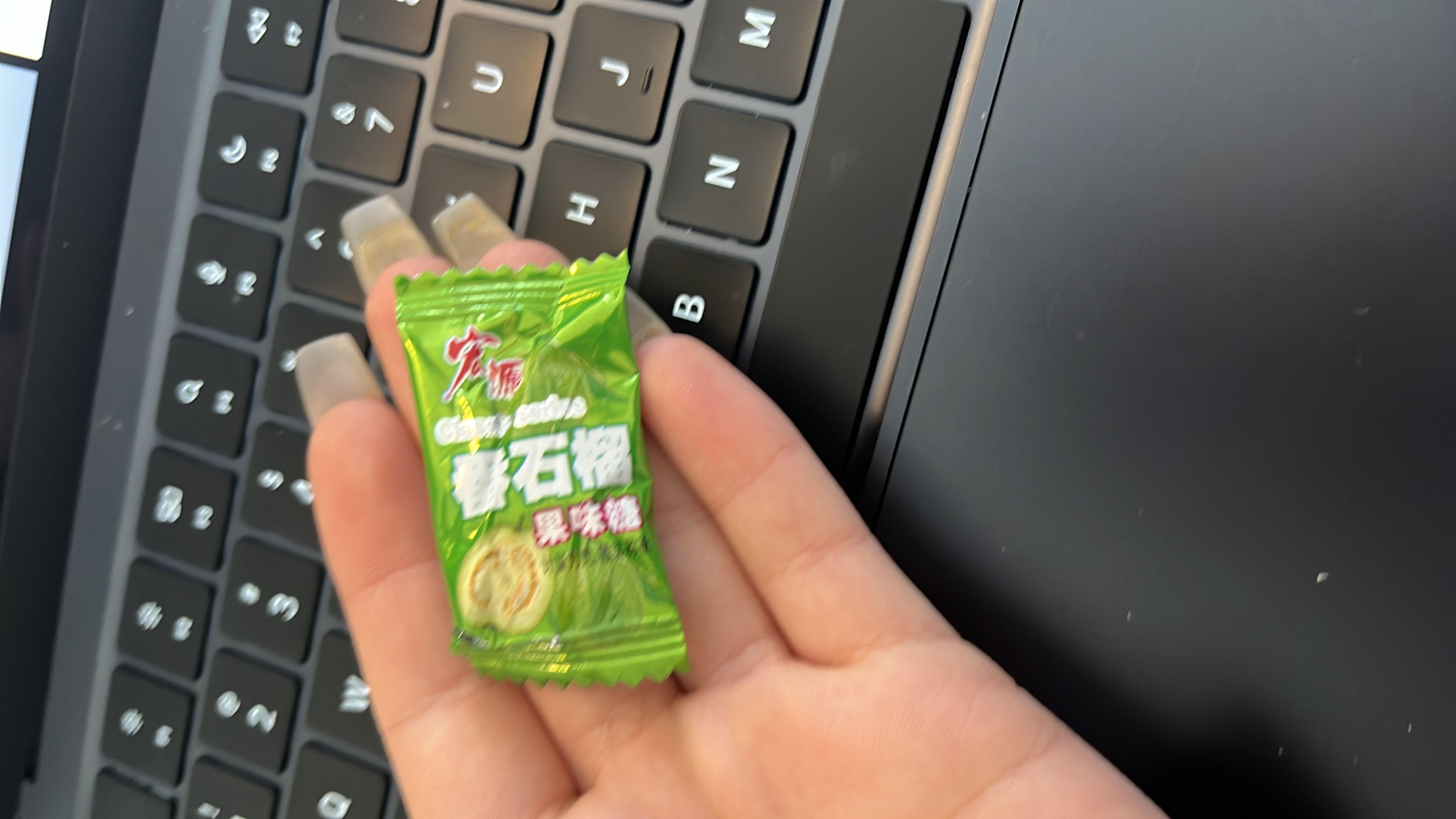 A small lime-flavored candy with moderate calorie content and no protein or fat.