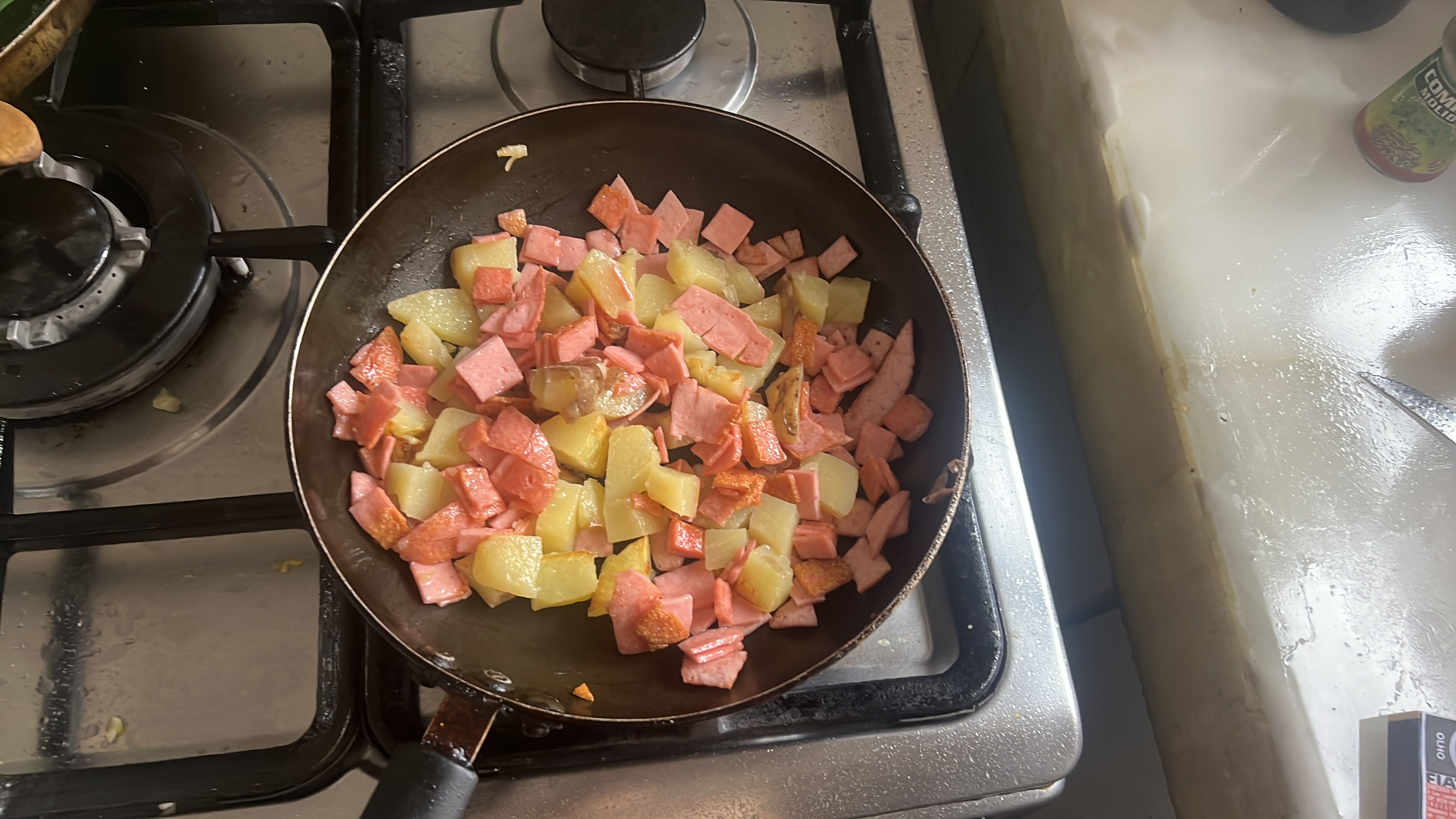 A dish consisting of diced potatoes and sausage cooked together, providing a balanced mix of carbs, protein, and fats.