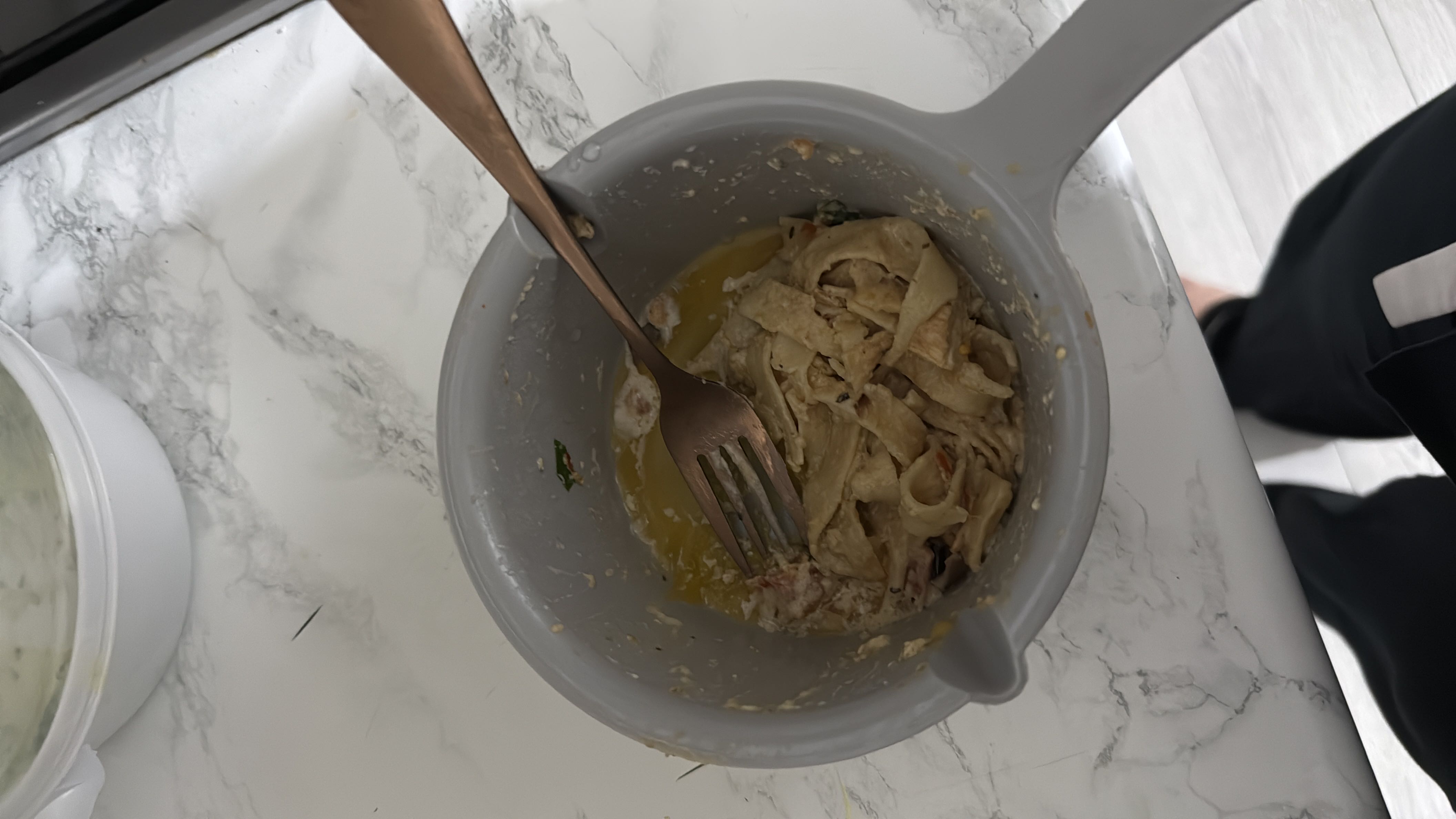 A bowl of pasta with butter and herbs, providing a moderate calorie count and a balanced mix of macronutrients.