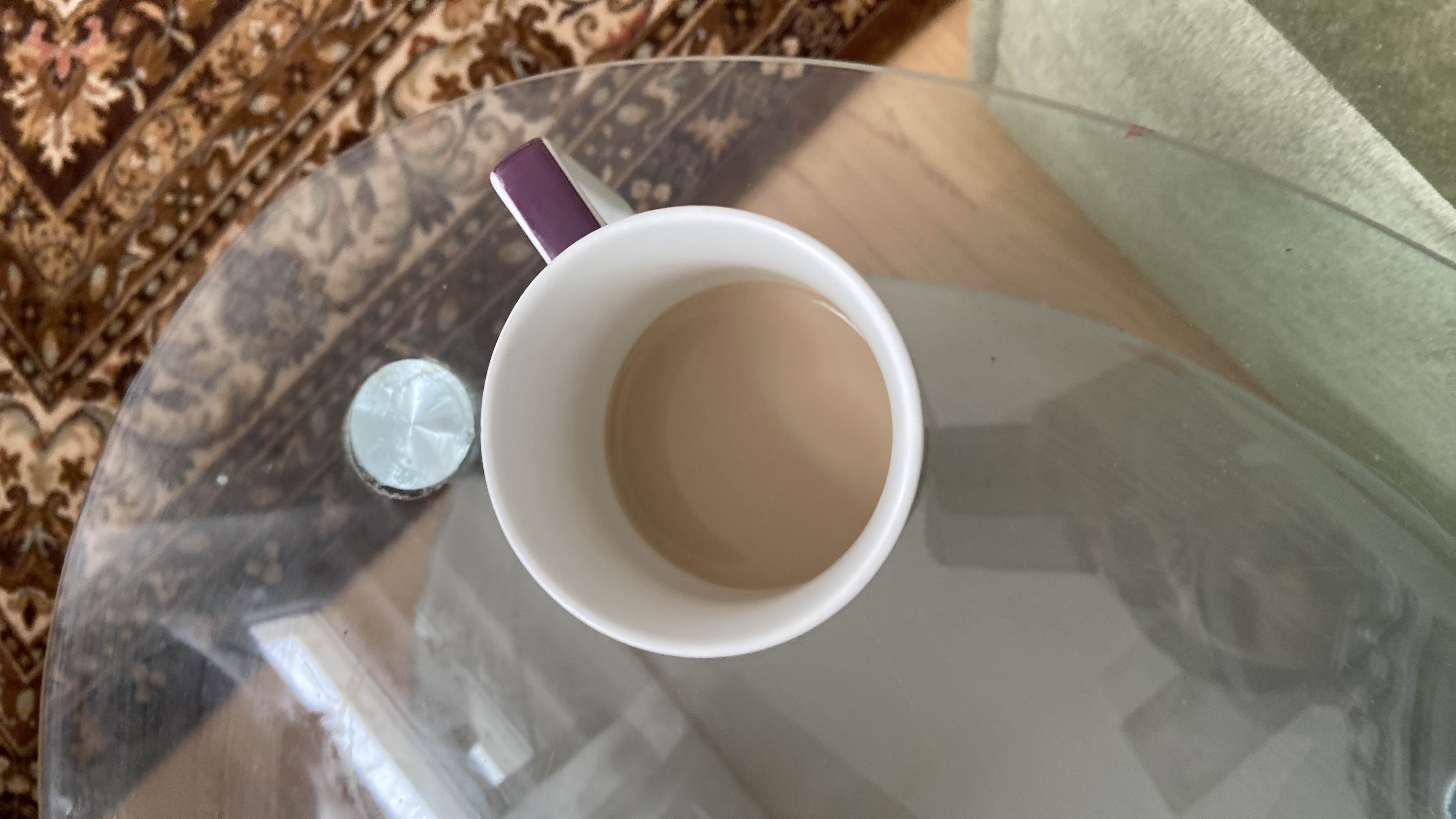 A cup of milk tea with moderate calories, low protein, and fats.