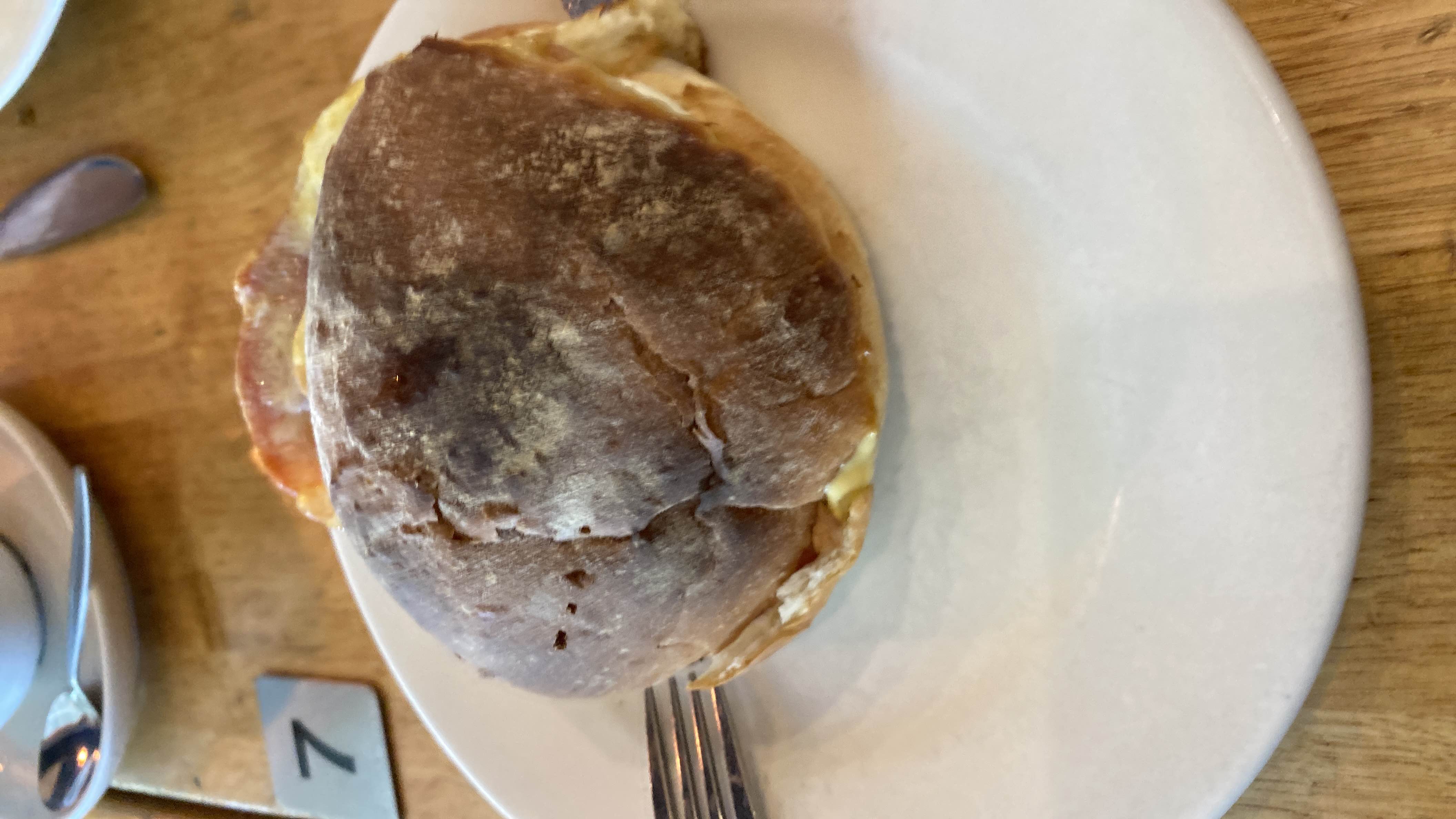 A sandwich with bread, cheese, and ham, providing a balanced mix of carbs, protein, and fats.