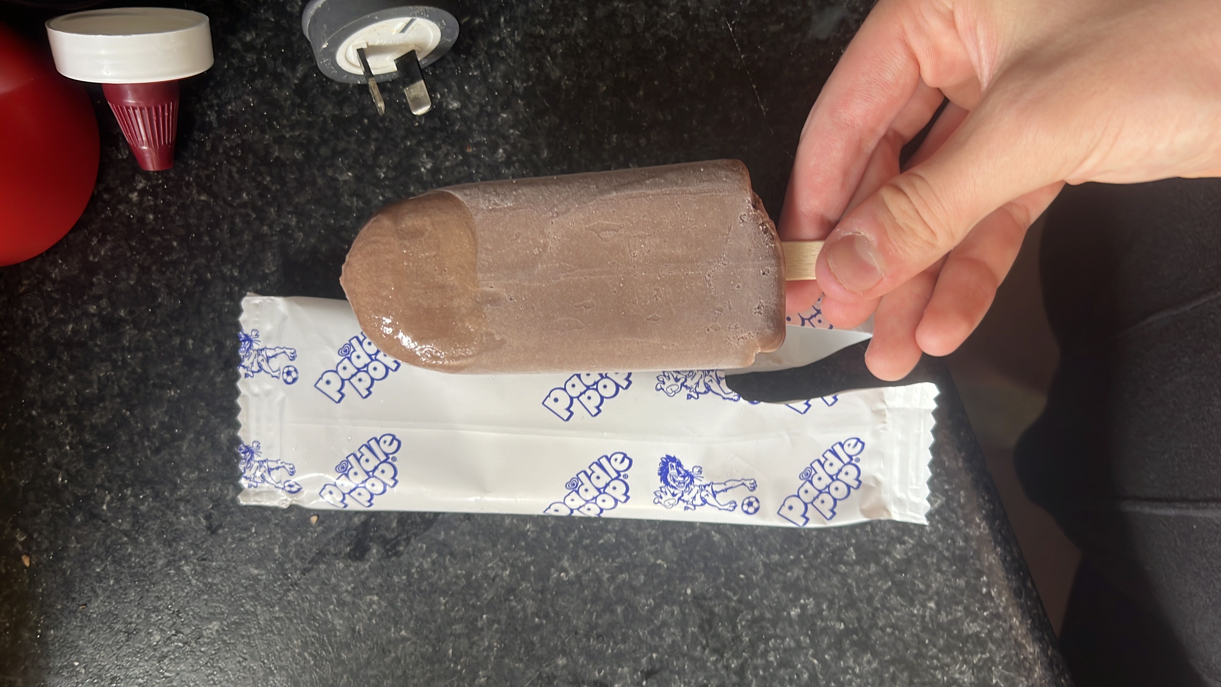 A chocolate-flavored ice cream bar with moderate calories and a balanced nutritional profile.