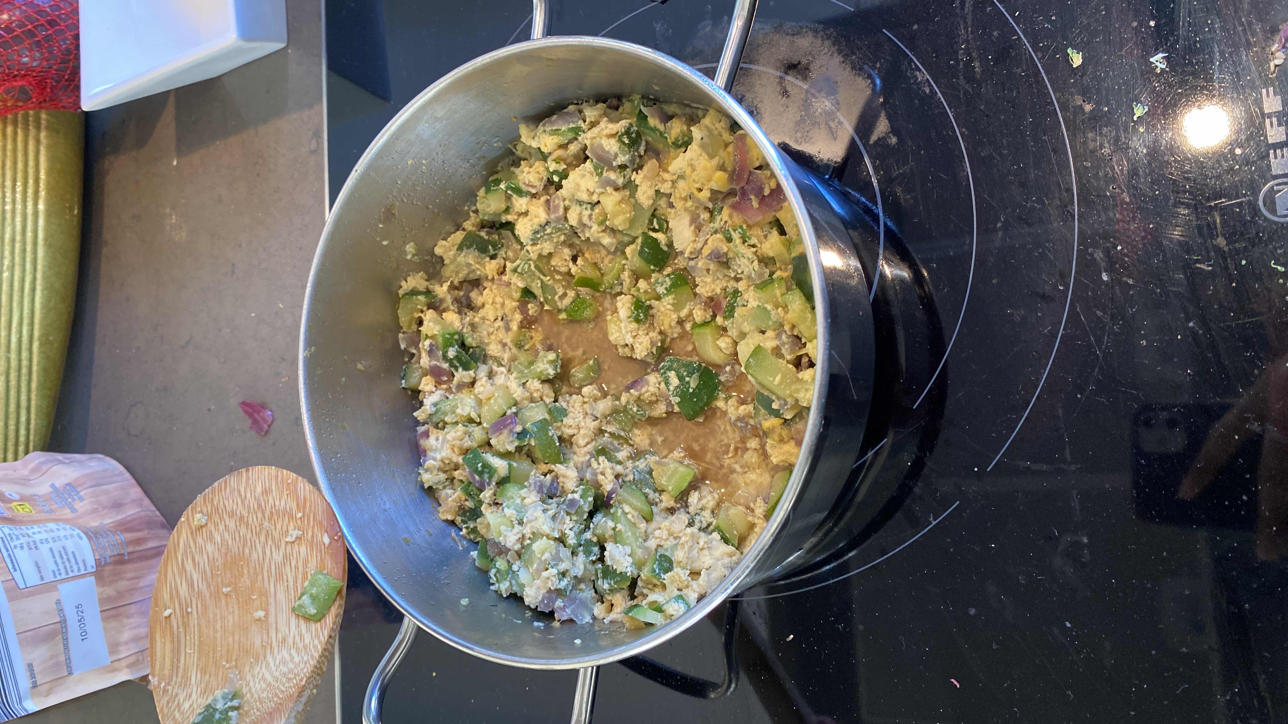 A nutritious dish made with scrambled eggs, zucchini, onions, and bell peppers, providing a balanced mix of protein, carbs, and fats.