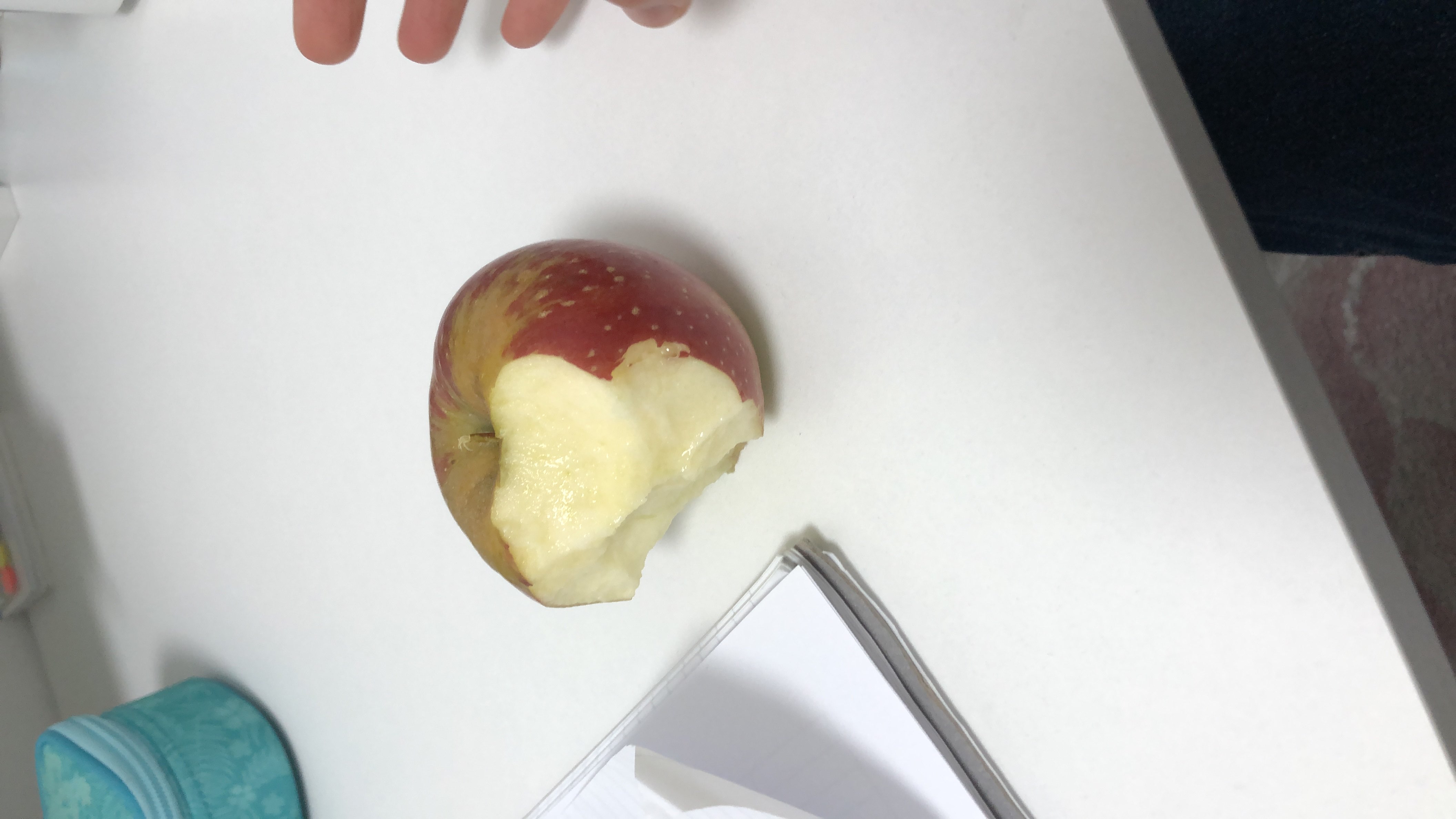 A partially eaten apple, a healthy snack rich in carbohydrates and low in fats and protein.