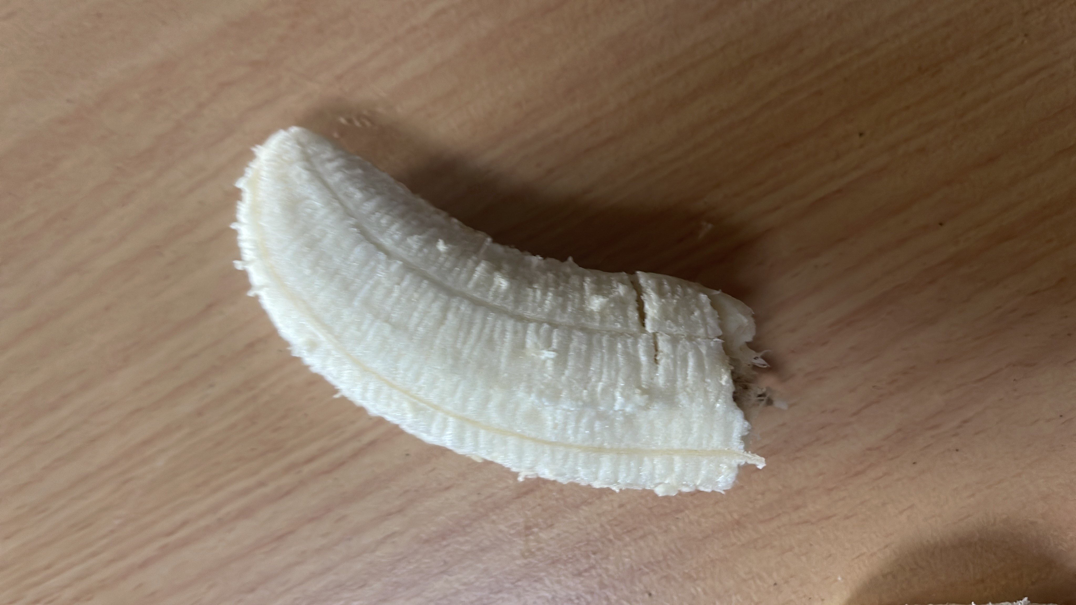 This is a peeled banana, a nutritious fruit rich in carbohydrates and low in fats.