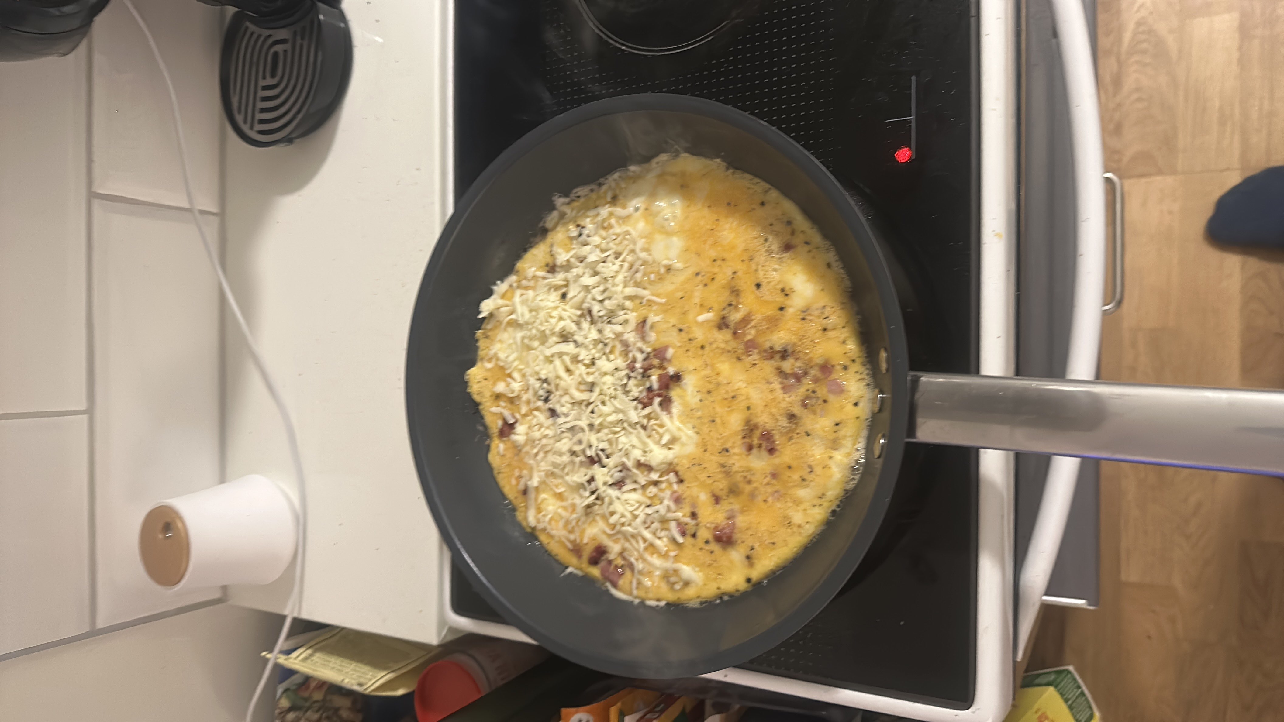 A cheese and bacon omelette made with 4 eggs, high in protein and fats with minimal carbohydrates.