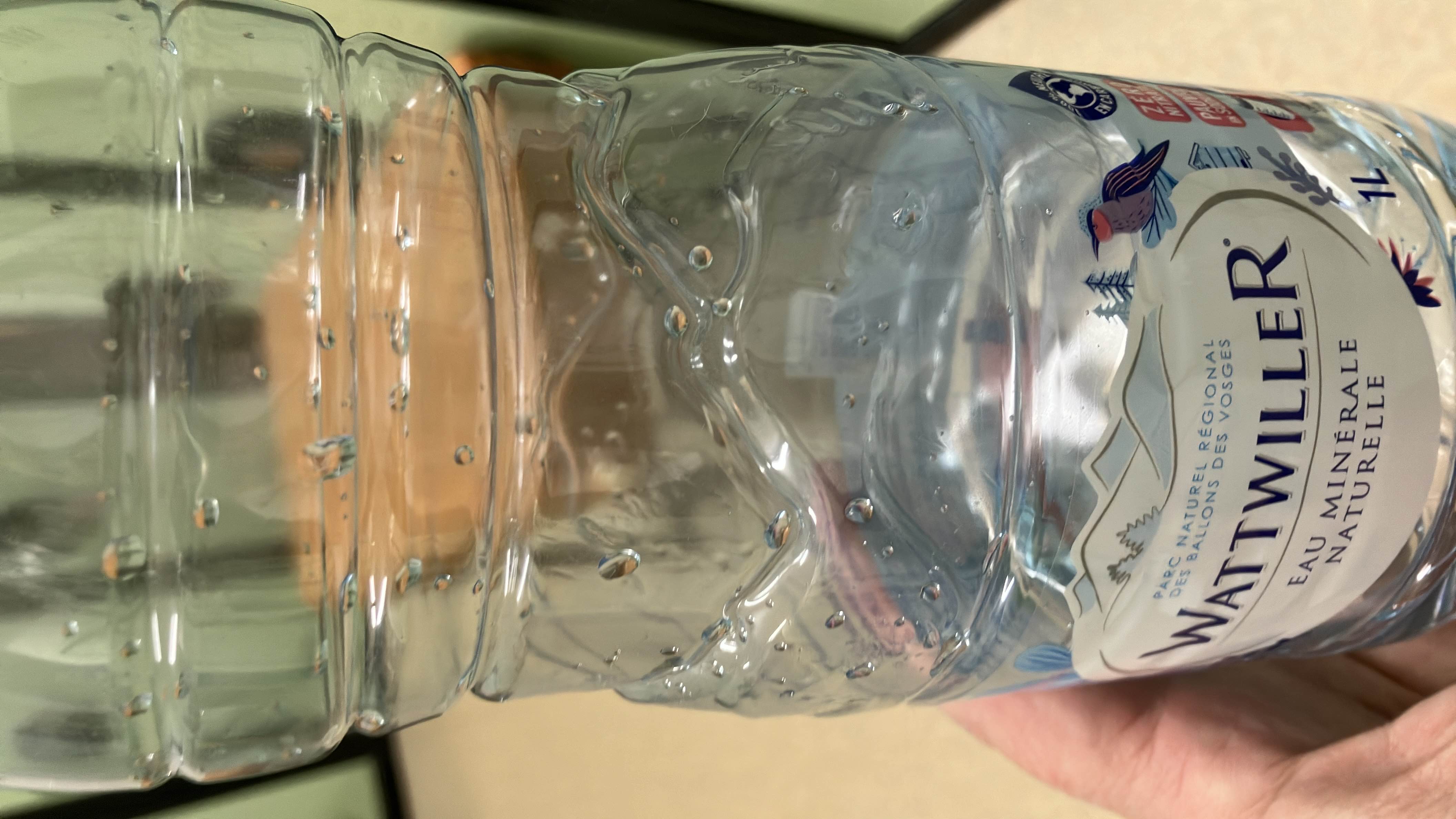 This is a bottle of natural mineral water with no calories, fats, proteins, or carbohydrates.