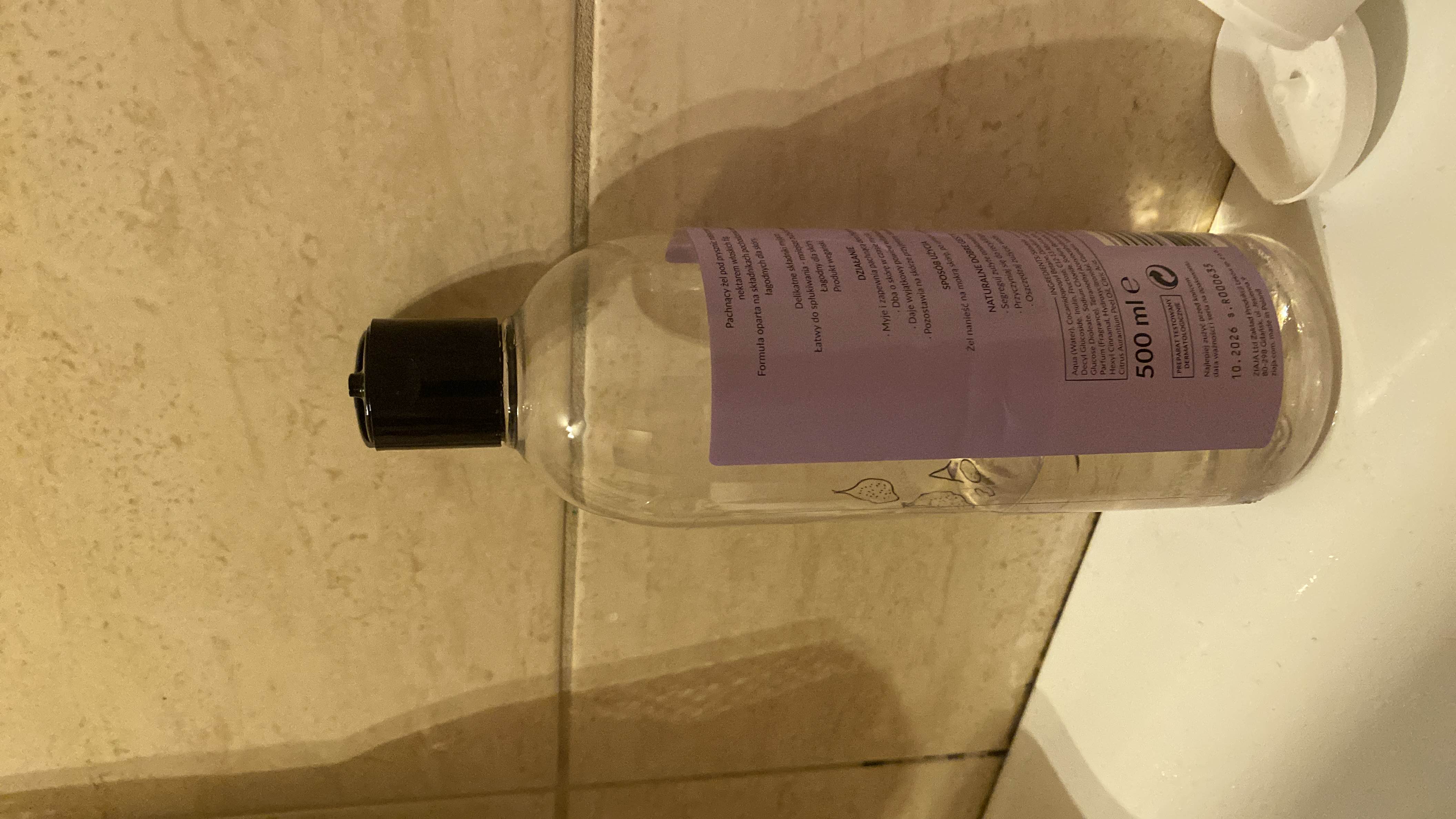 The image depicts a bottle of cosmetic product, not food, and therefore does not contain nutritional information.