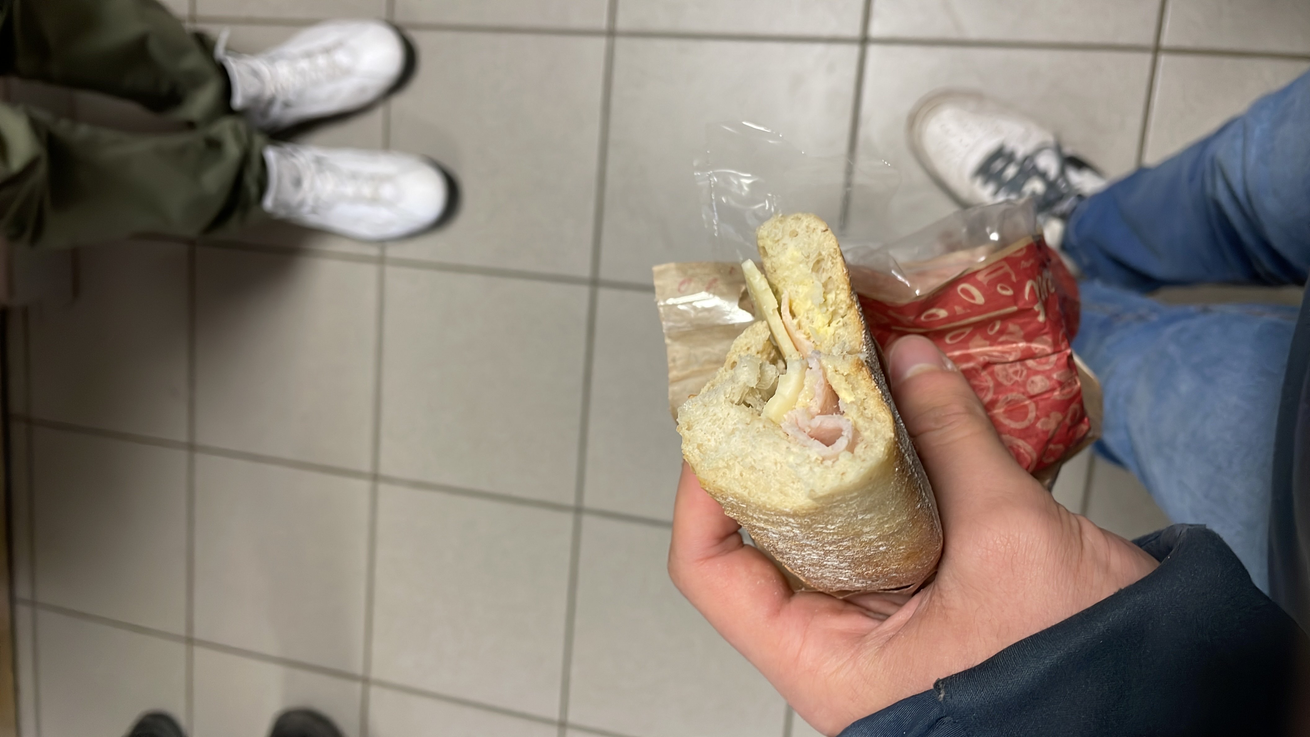 A sandwich containing bread, ham, and cheese, providing a moderate calorie count and balanced macronutrients.