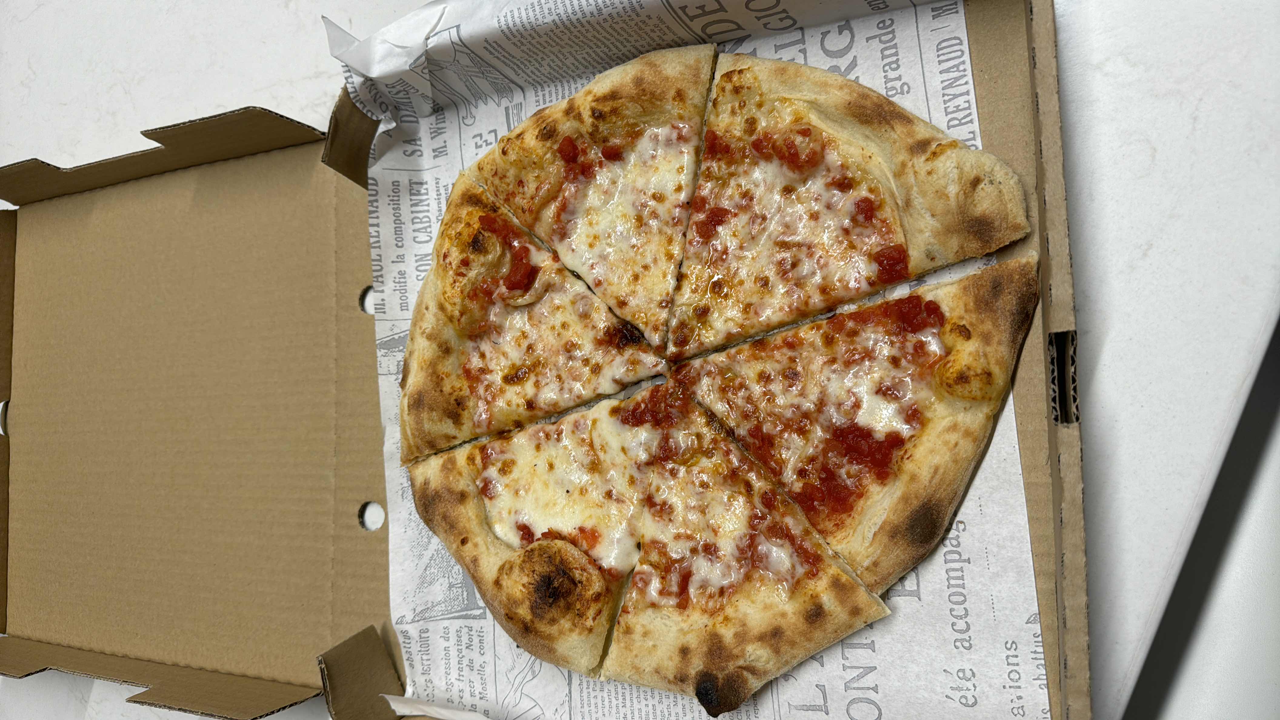 A classic cheese pizza with tomato sauce and a crispy crust, providing a balanced mix of carbs, fats, and protein.