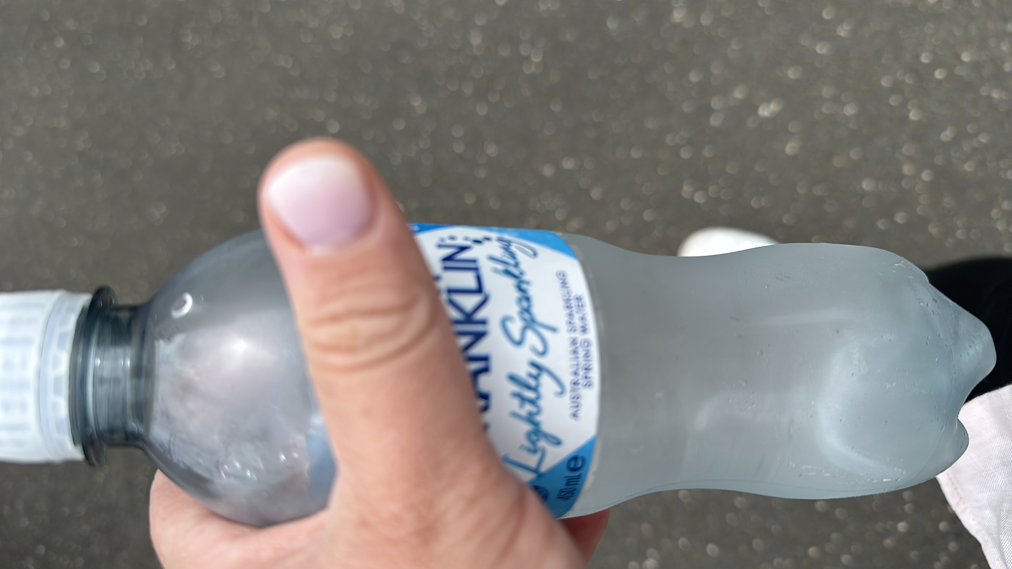 This is a bottle of lightly sparkling water with no calories, fats, proteins, or carbohydrates.
