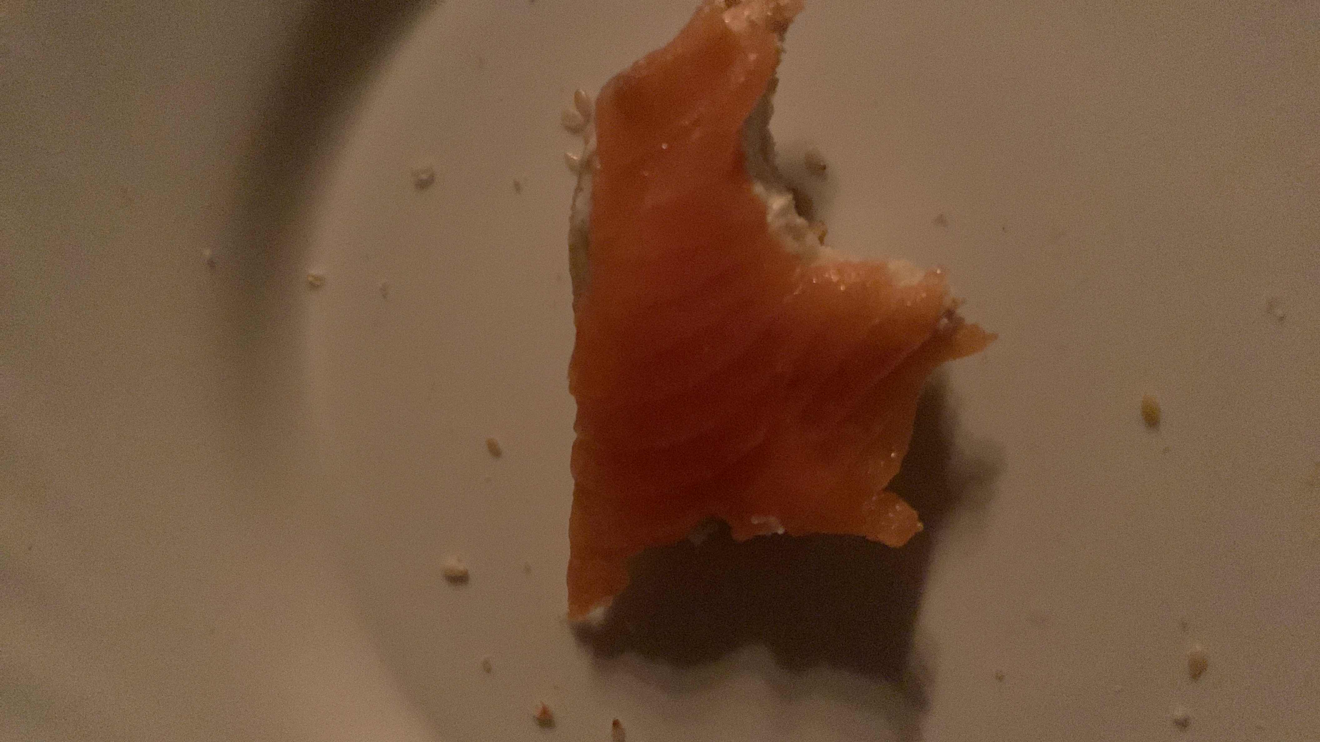 A small portion of smoked salmon, a high-protein, low-carb food with moderate fat content.
