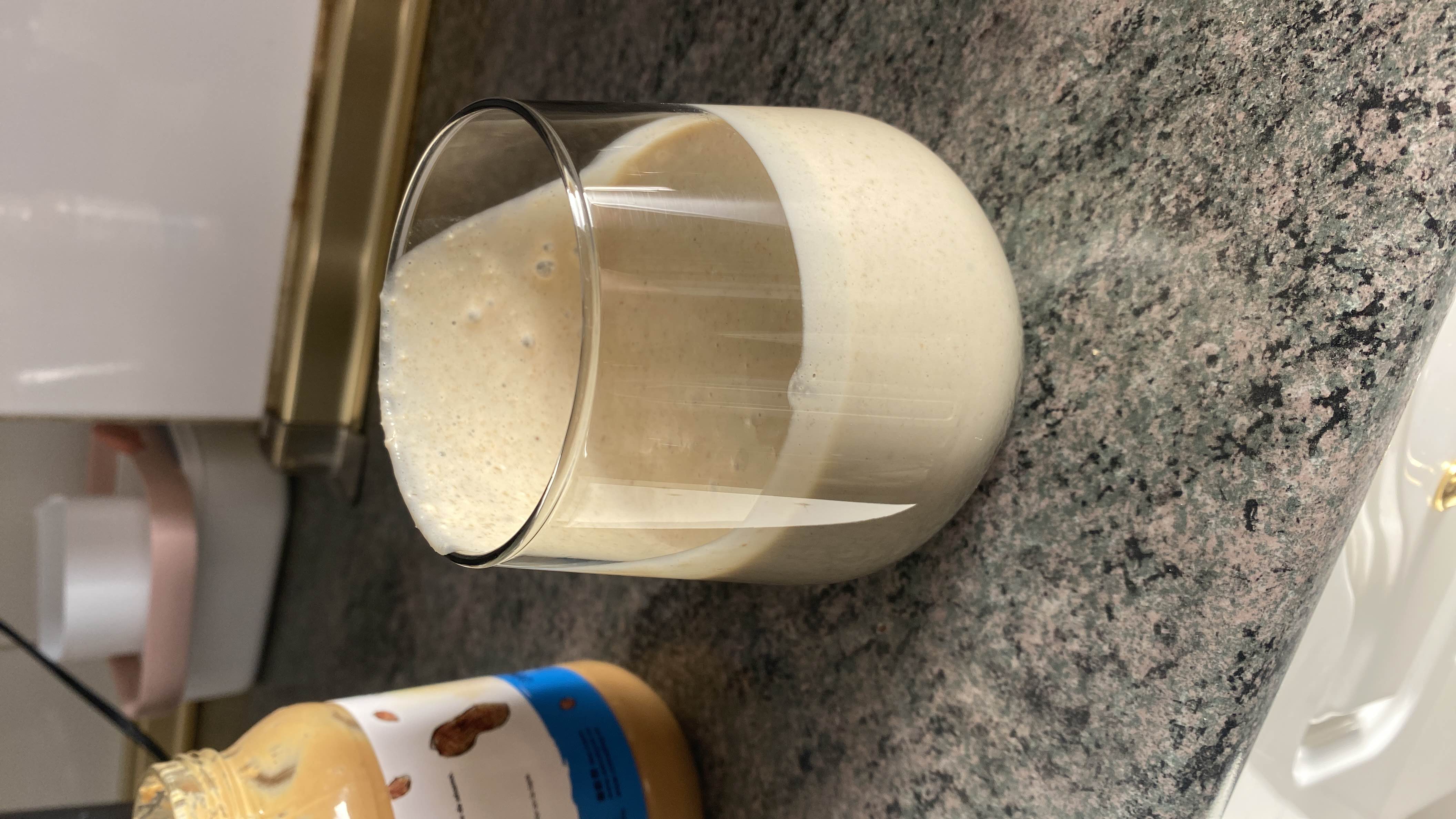 A creamy peanut butter and banana smoothie, rich in protein and healthy fats.