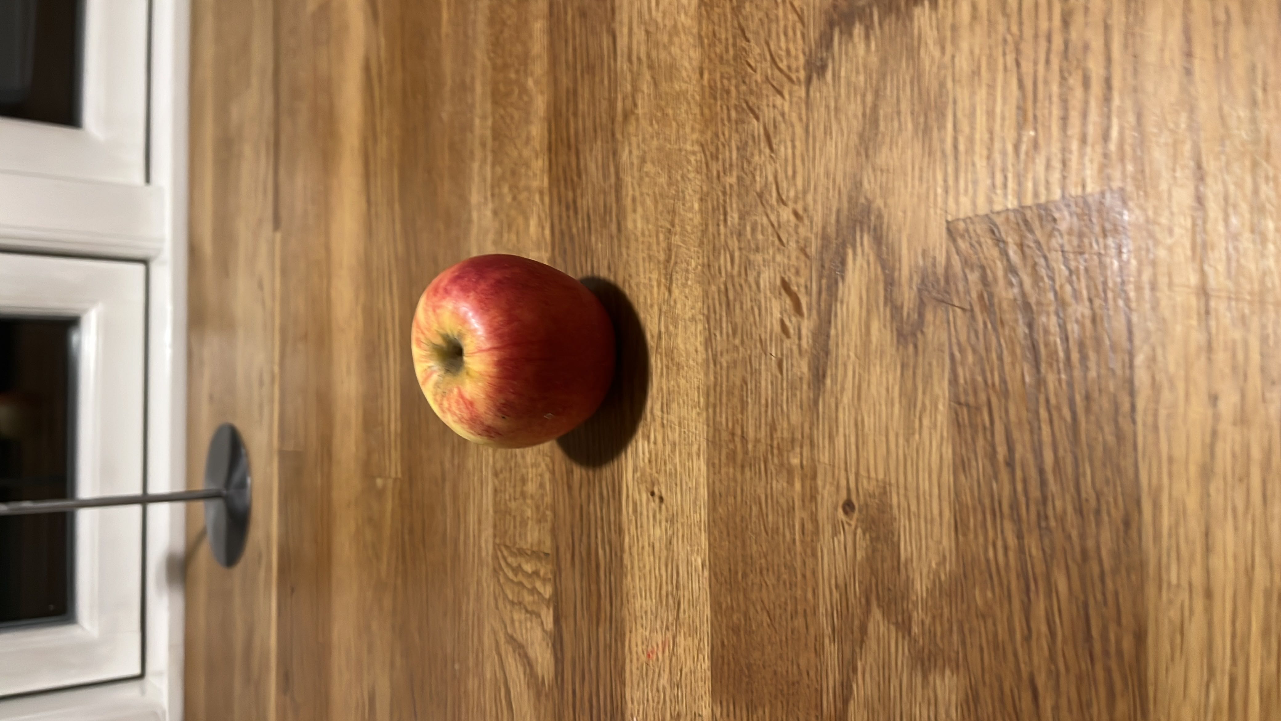 This image shows an apple, a nutritious fruit that is low in calories and fats, high in carbohydrates, and provides a good health score.