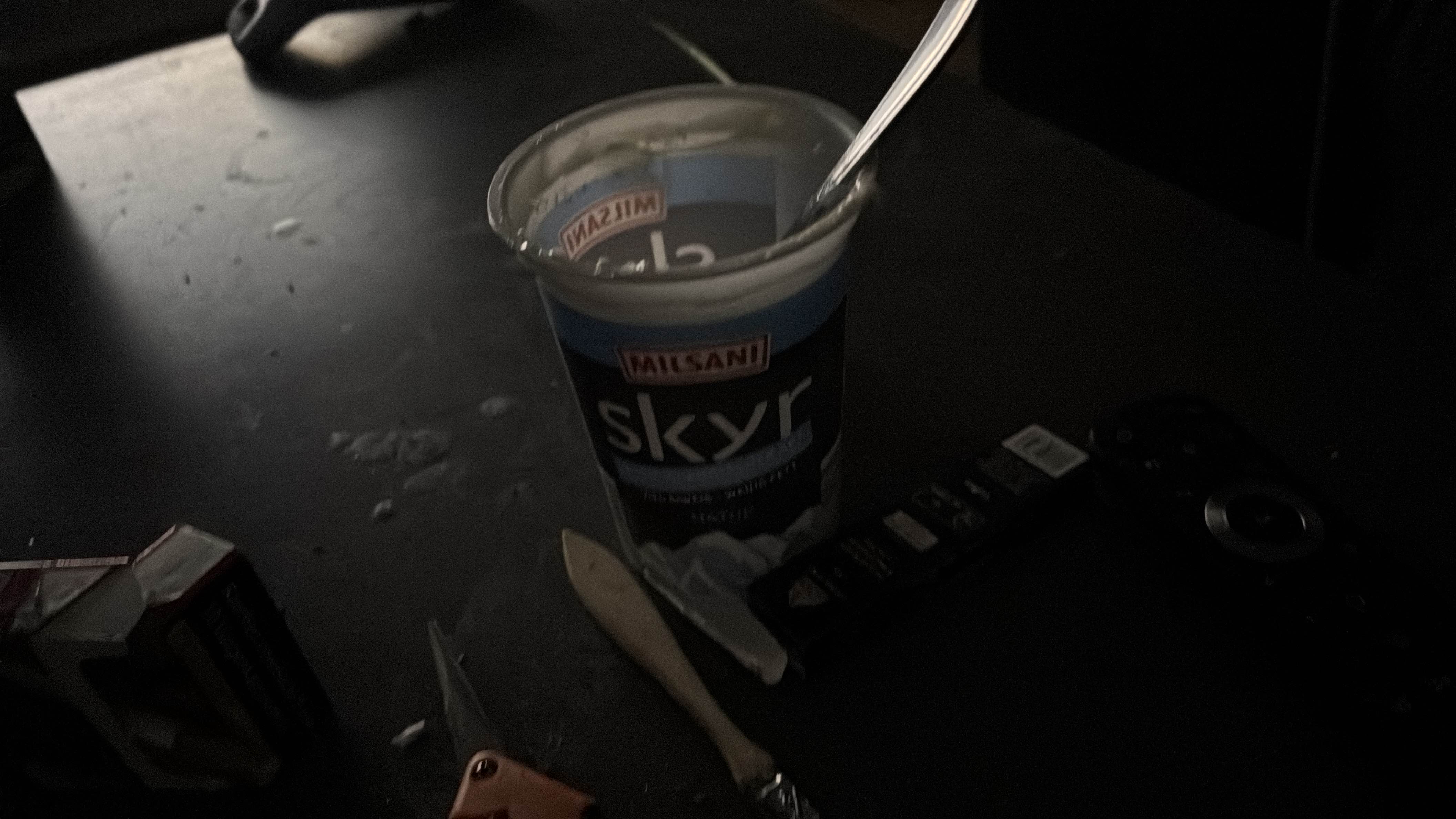 The image shows a container of Skyr yogurt, a high-protein, low-fat dairy product.