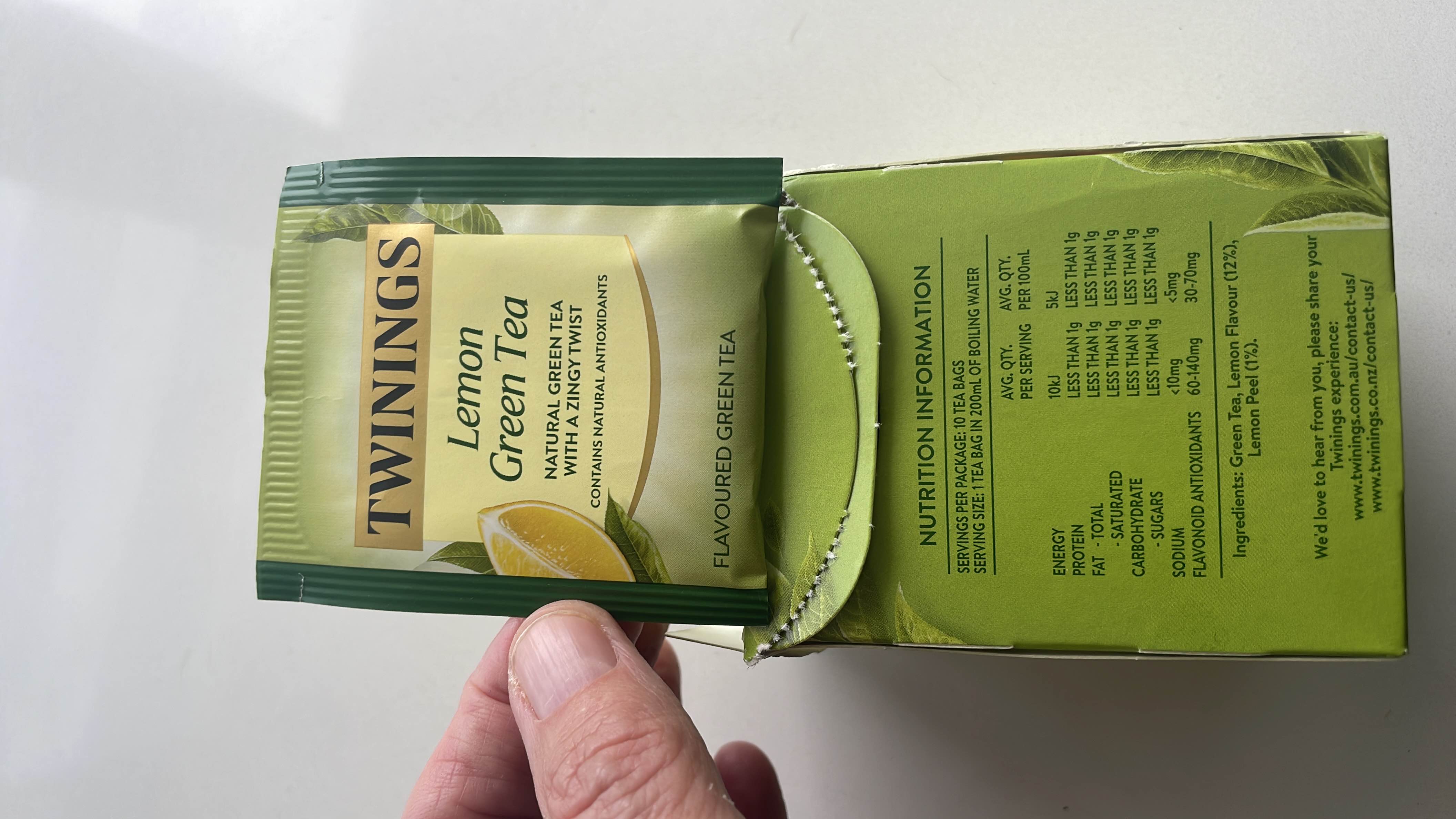 Twinings Lemon Green Tea is a natural green tea with a lemon flavor, containing less than 1g of protein, fat, and carbohydrates per serving. It is rich in flavonoid antioxidants.