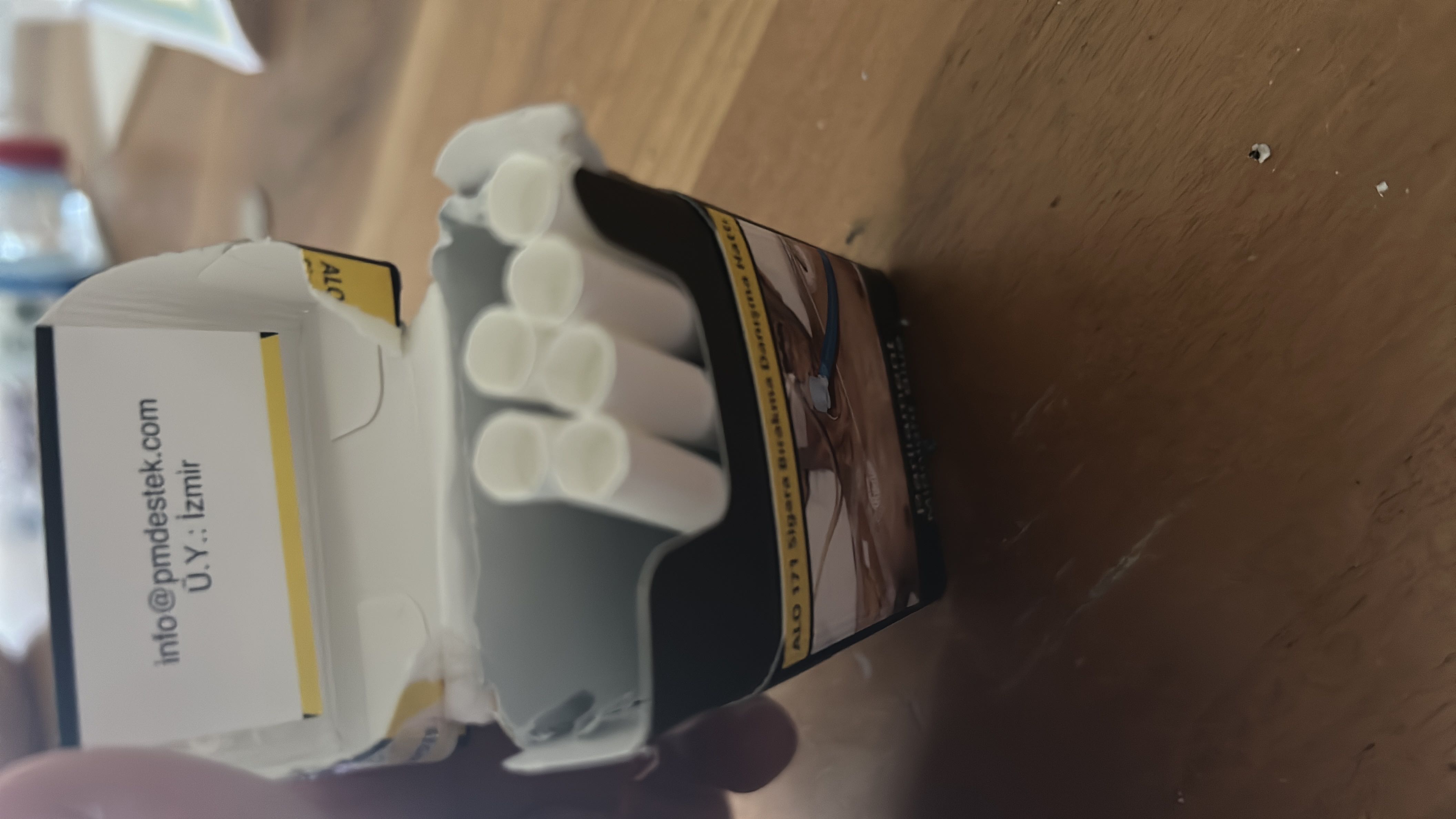 The image depicts a pack of cigarette-like items, which do not contain nutritional information.