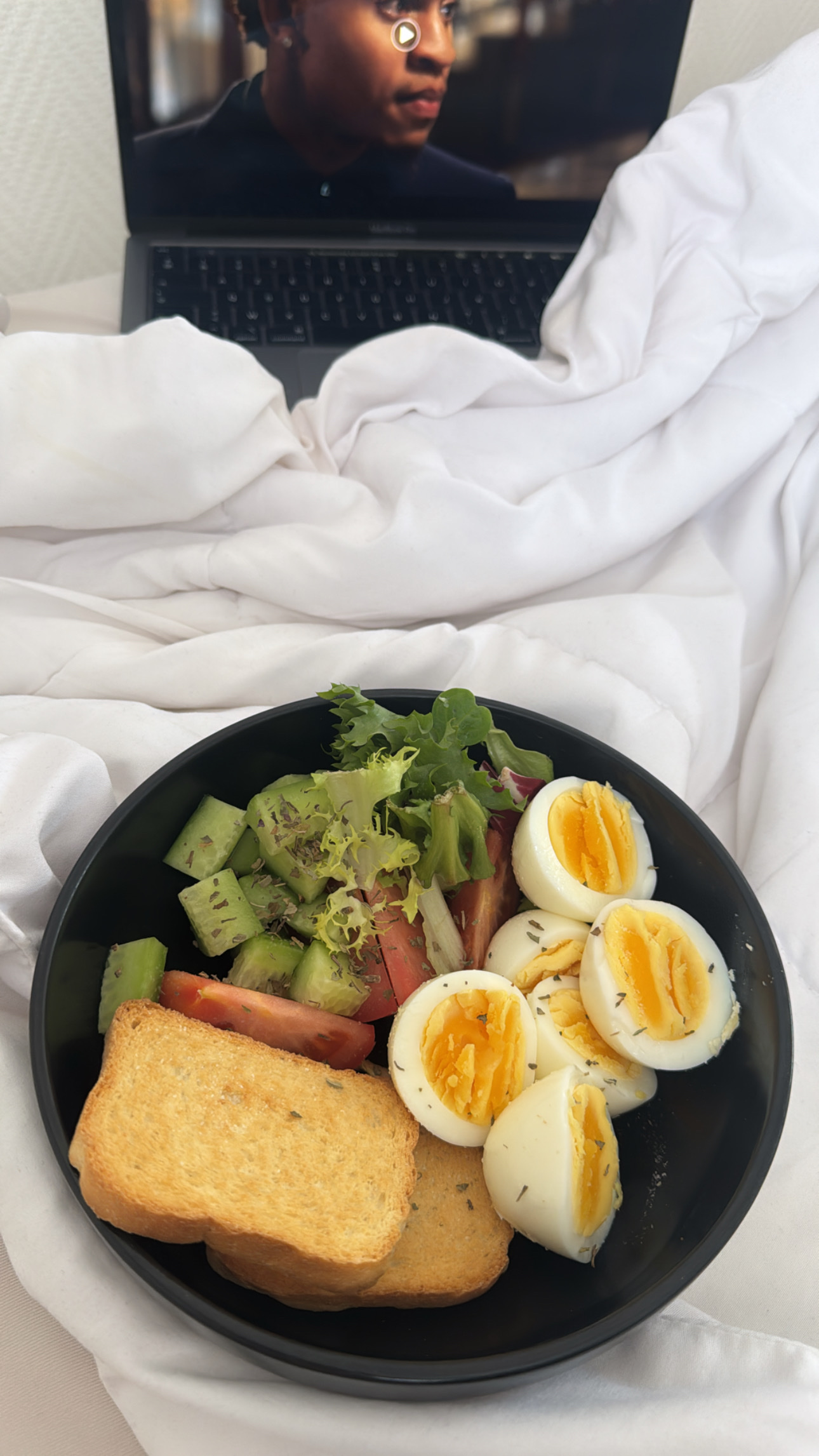 A balanced meal consisting of boiled eggs, toast, and a fresh salad, providing a good mix of protein, carbs, and fats.