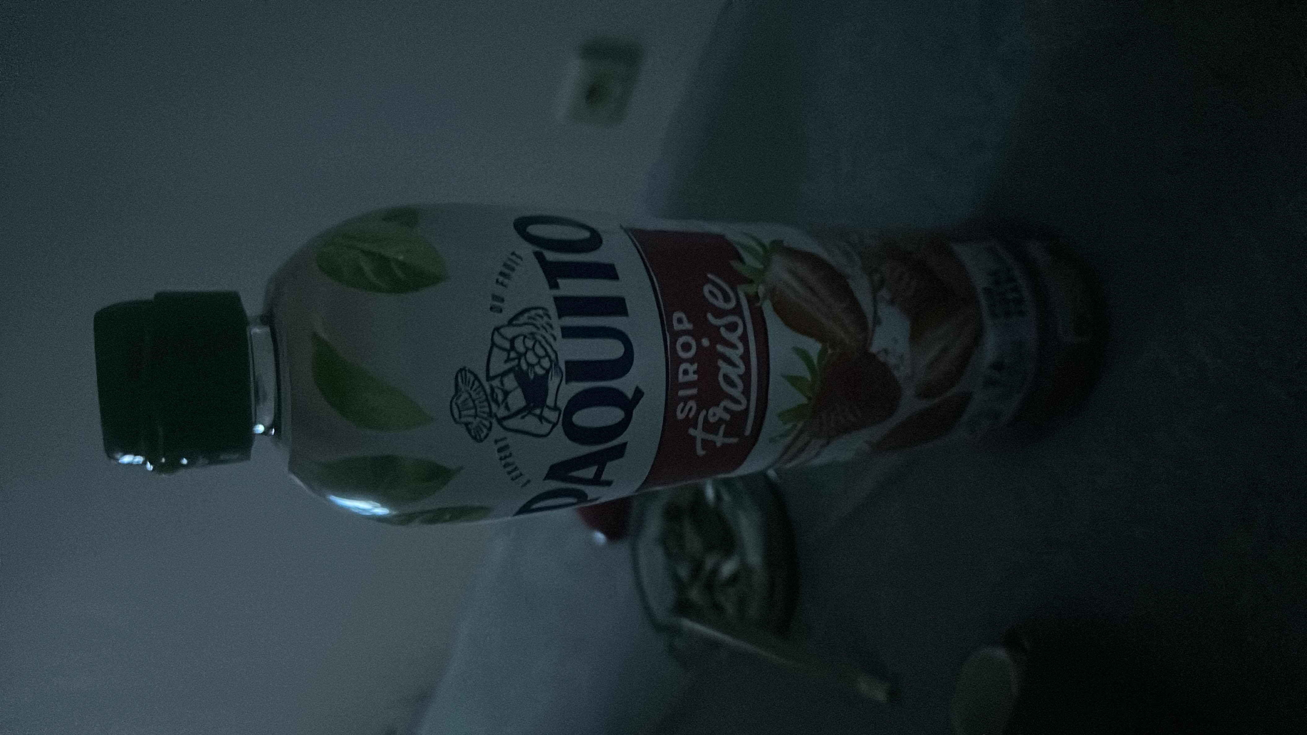 This is a strawberry-flavored syrup with moderate calorie content, primarily composed of carbohydrates and no fats or proteins.