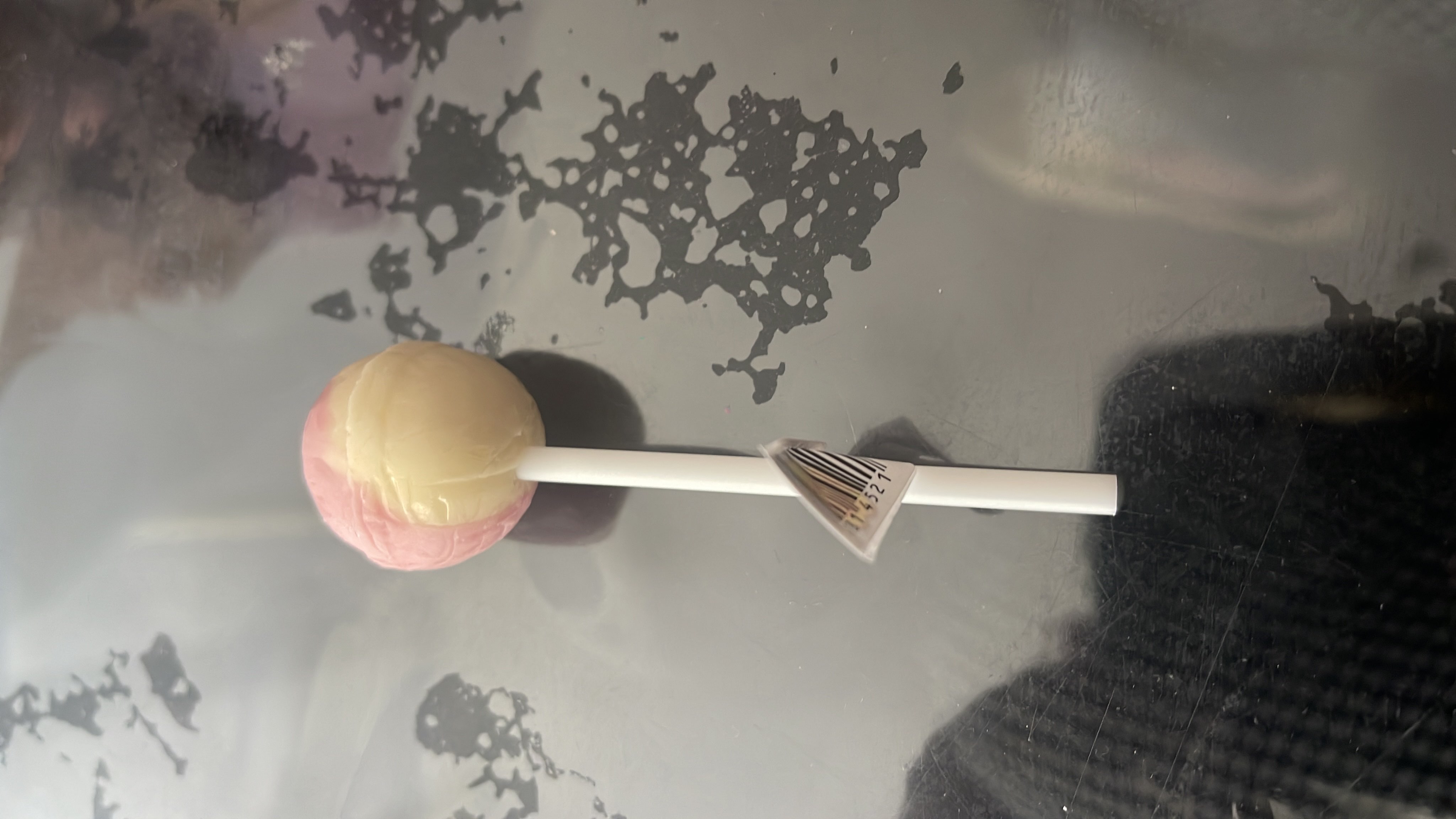 A lollipop containing sugar as the primary ingredient, with minimal nutritional value.