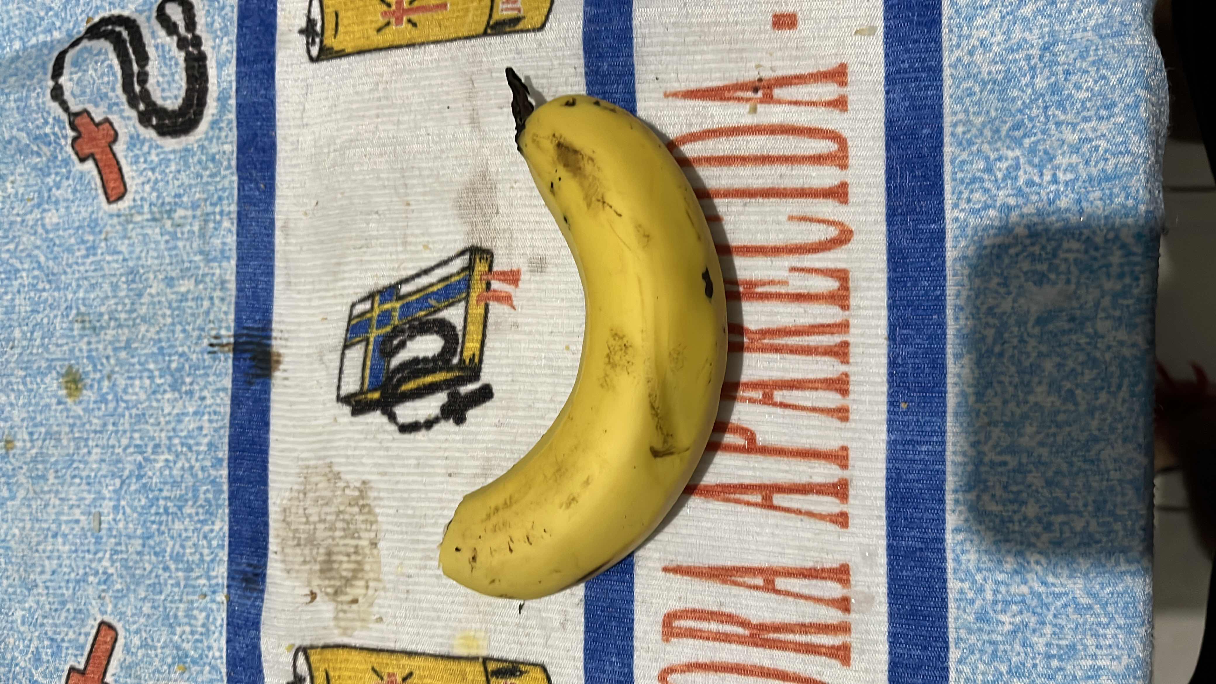 The image shows a banana, which is a nutritious fruit rich in carbohydrates and low in fats and protein.