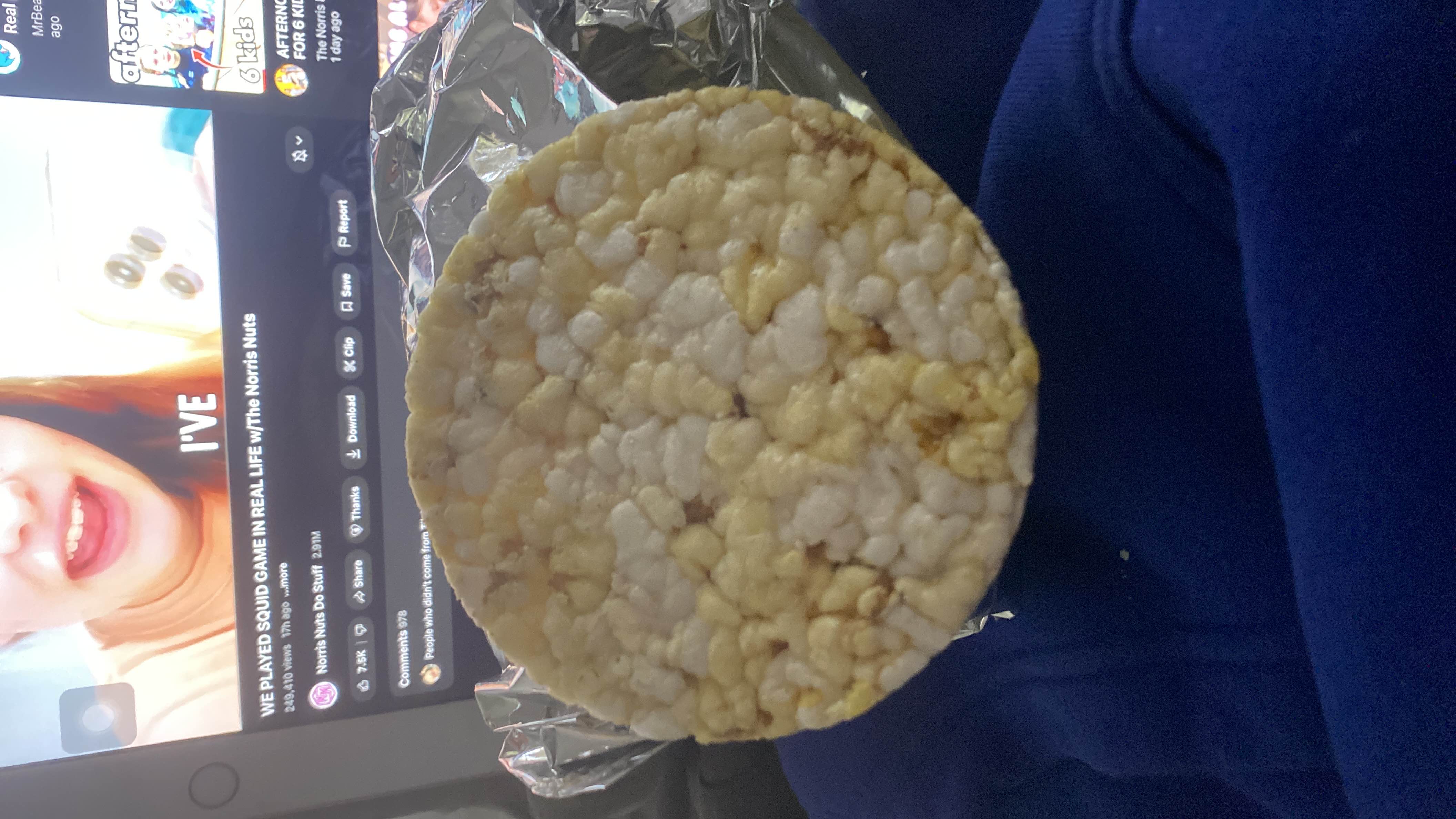 A single rice cake, a low-calorie snack made primarily of puffed rice, suitable for light snacking.