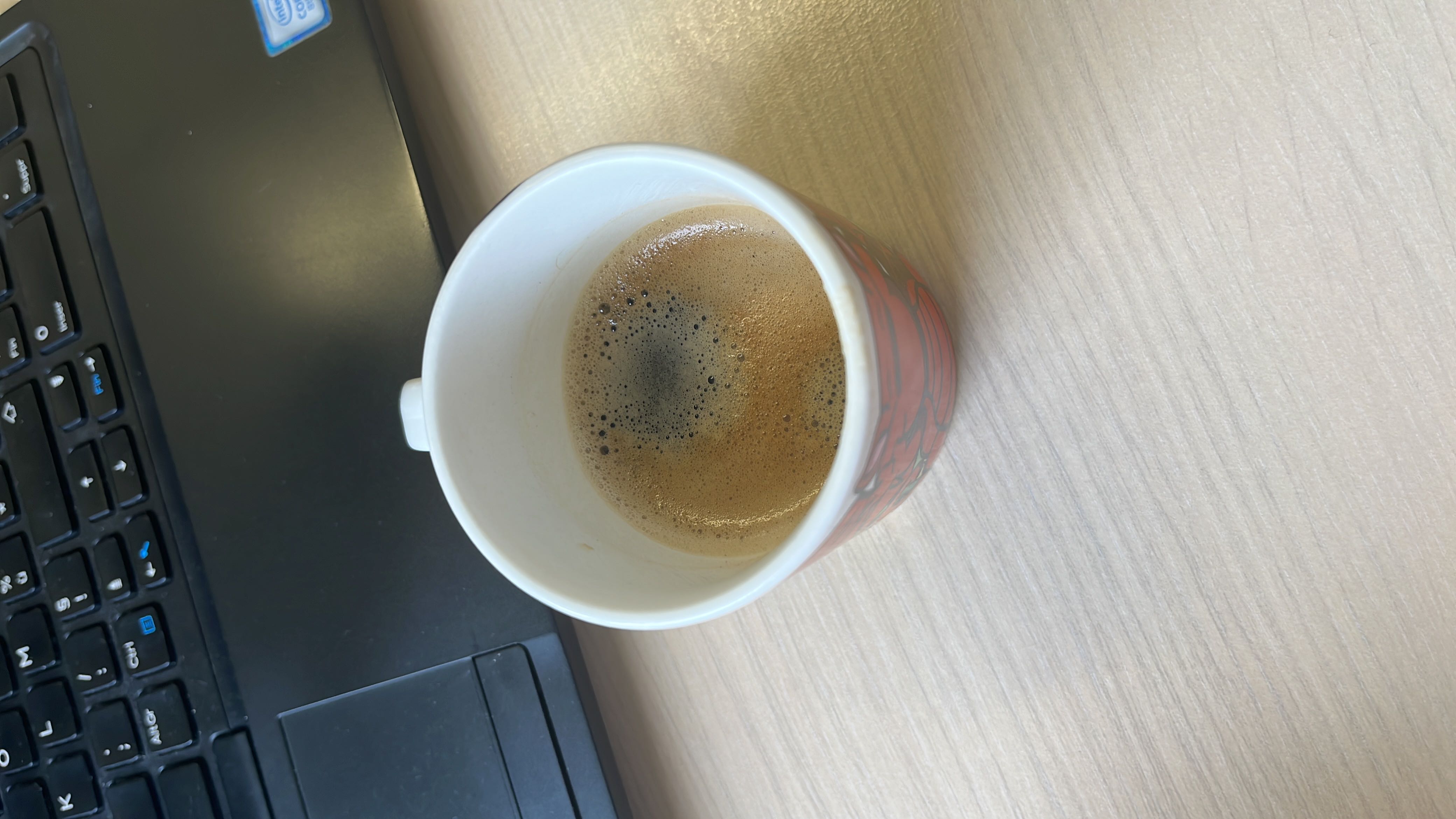 A cup of black coffee with minimal calories and no significant macronutrients, suitable for a low-calorie diet.