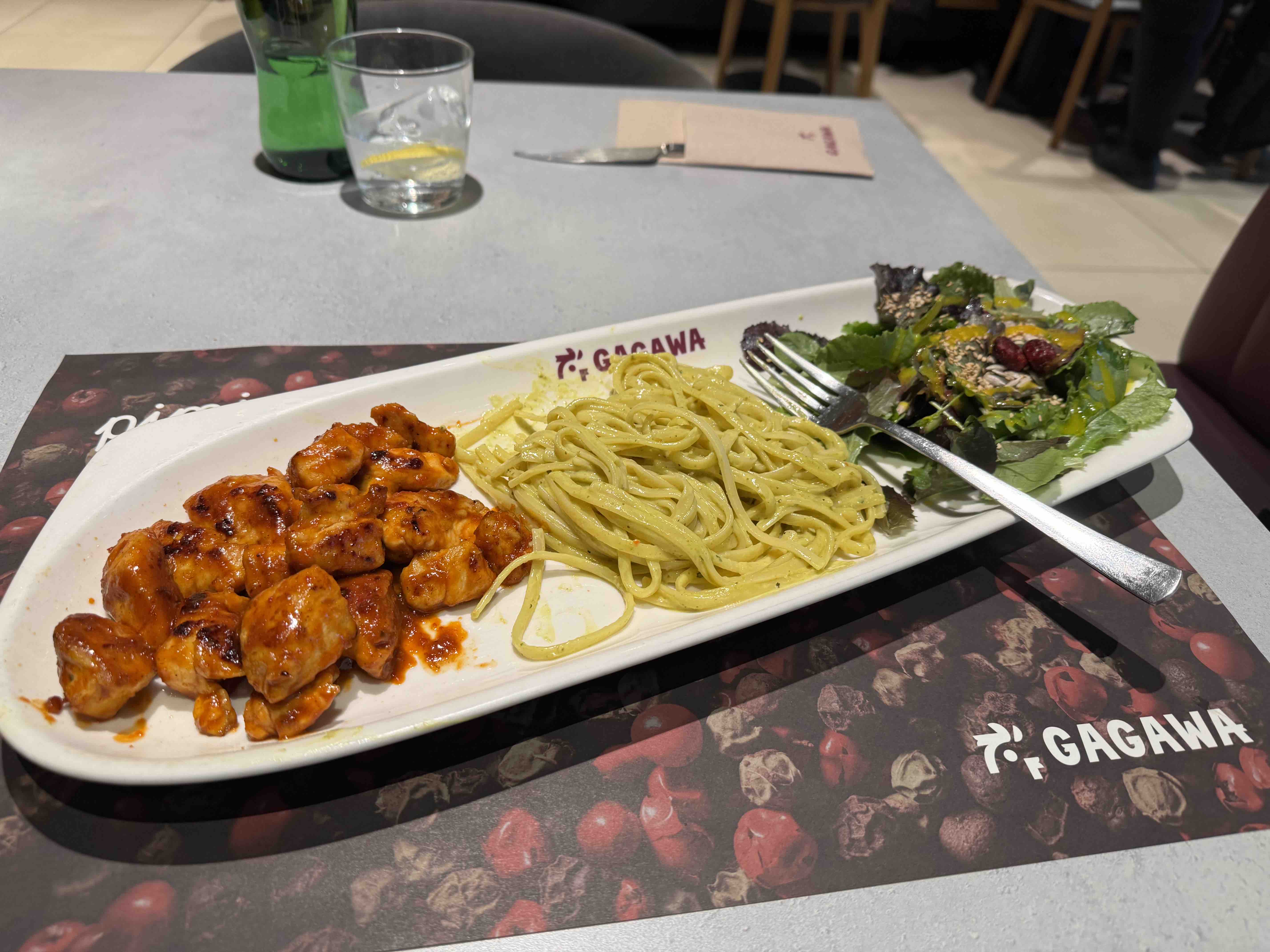 A balanced meal consisting of grilled chicken, pasta, and a fresh salad.