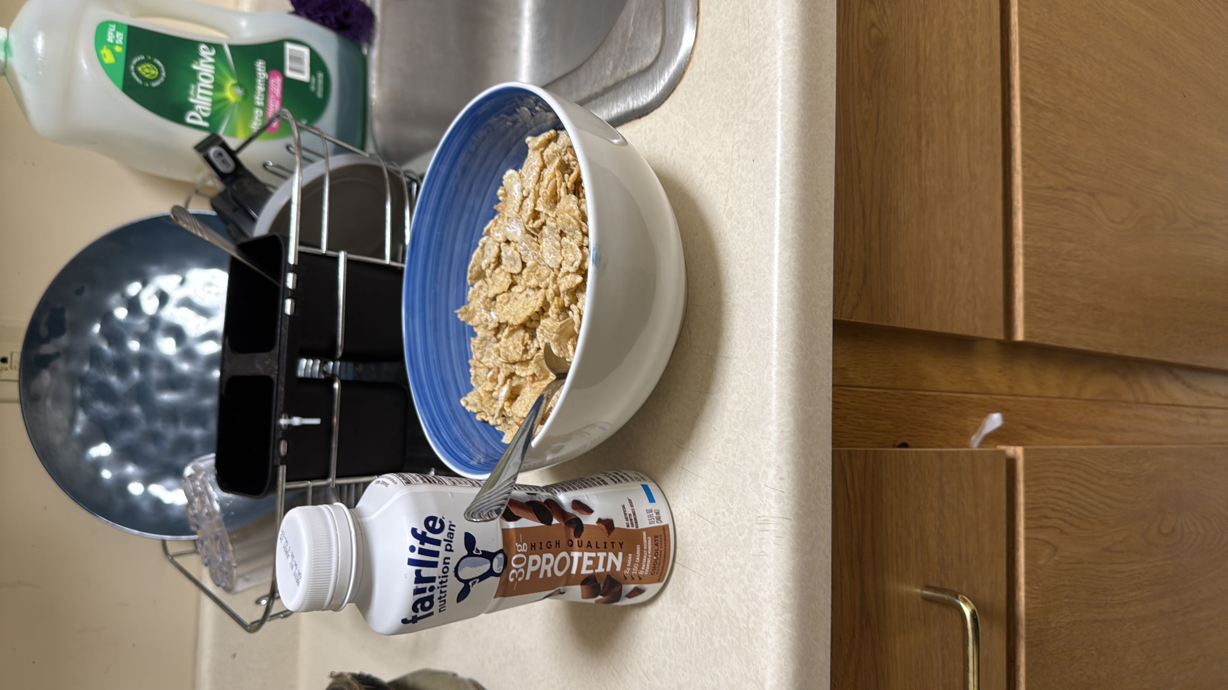 A bowl of cereal paired with a chocolate protein shake, providing a balanced mix of protein, carbs, and fats.