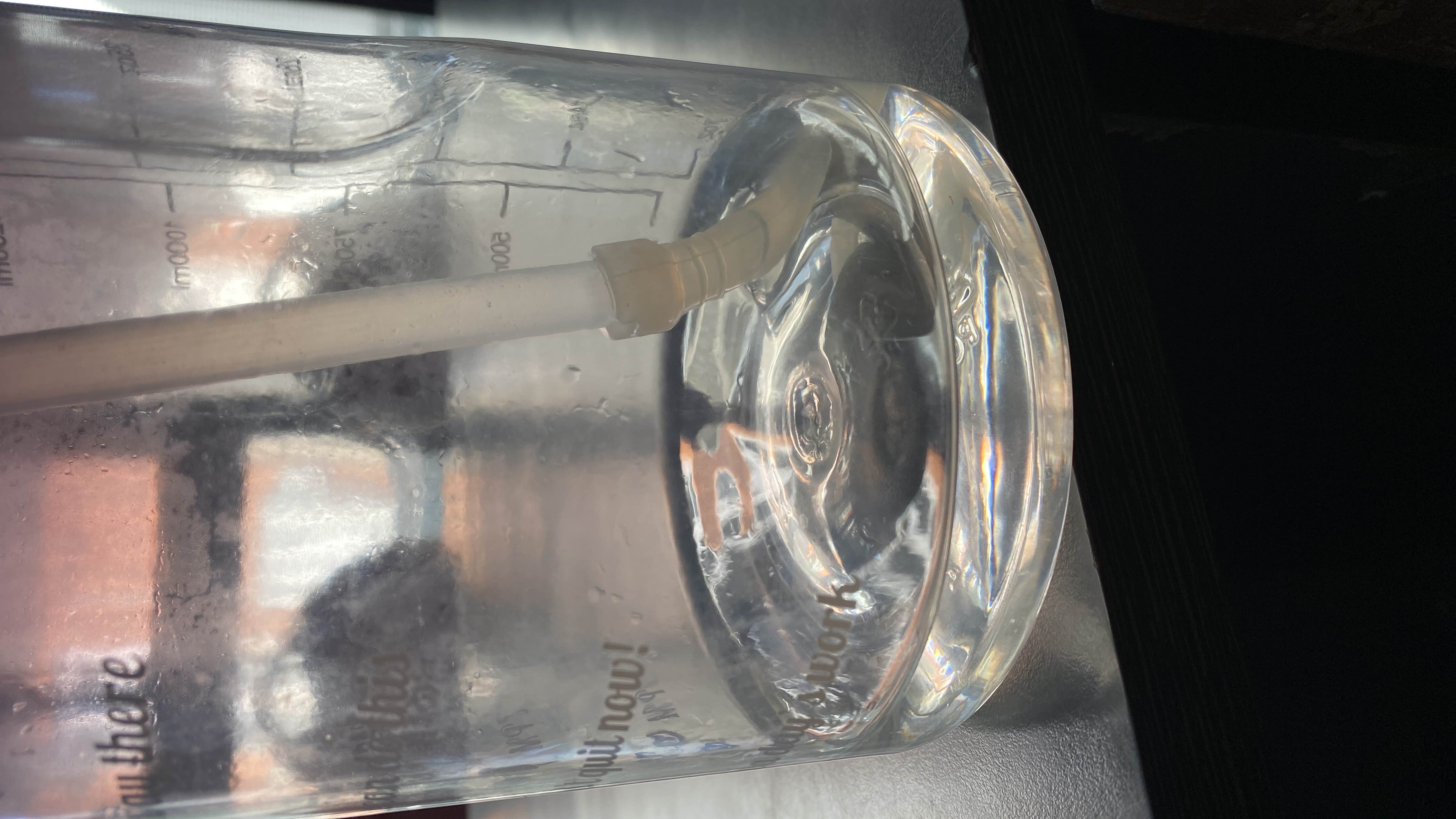The image shows a container of water, which has no calories, protein, carbs, or fats, making it a highly healthy and hydrating option.