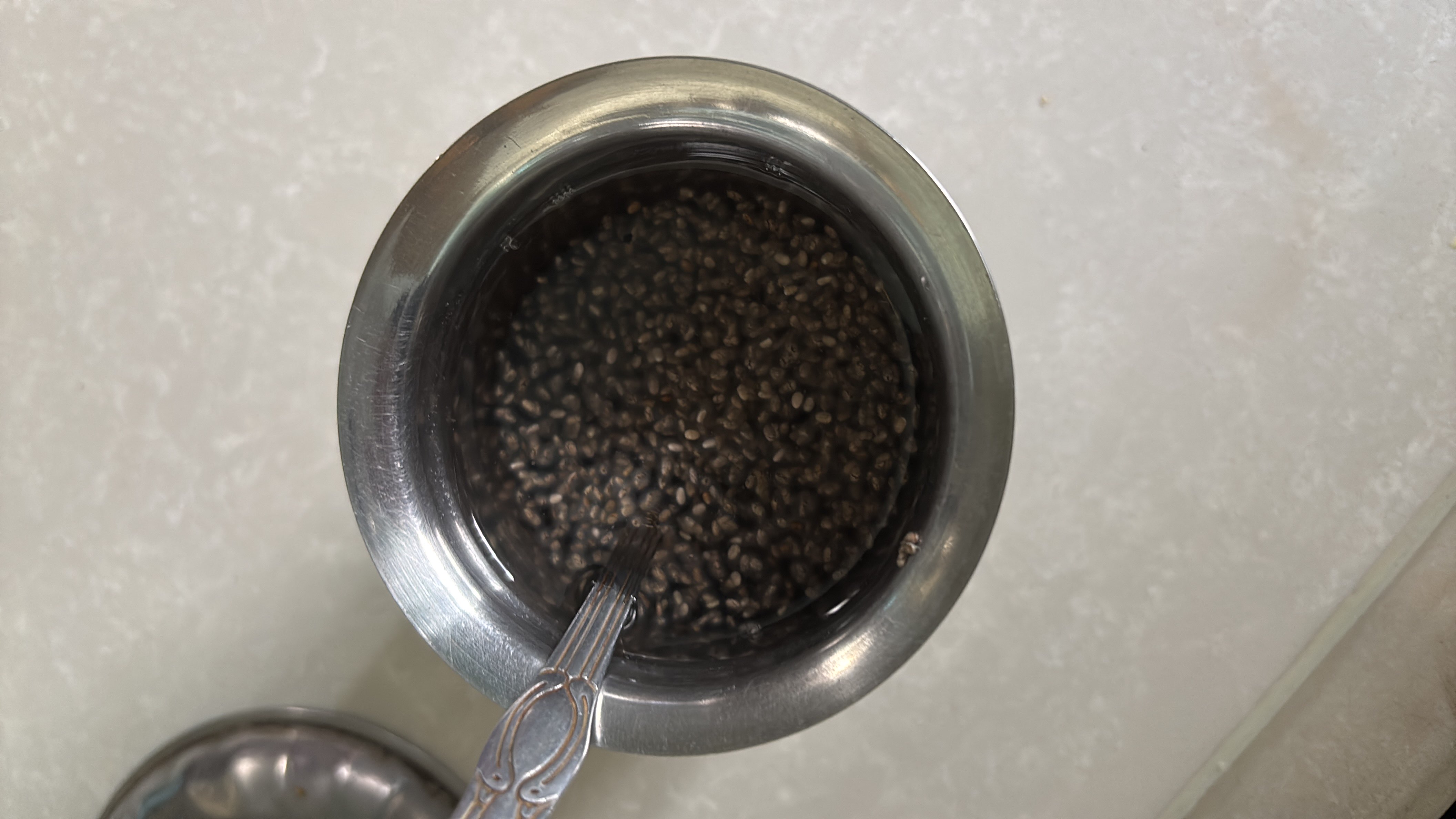 The image shows a serving of soaked chia seeds, which are rich in nutrients and commonly used in healthy diets.
