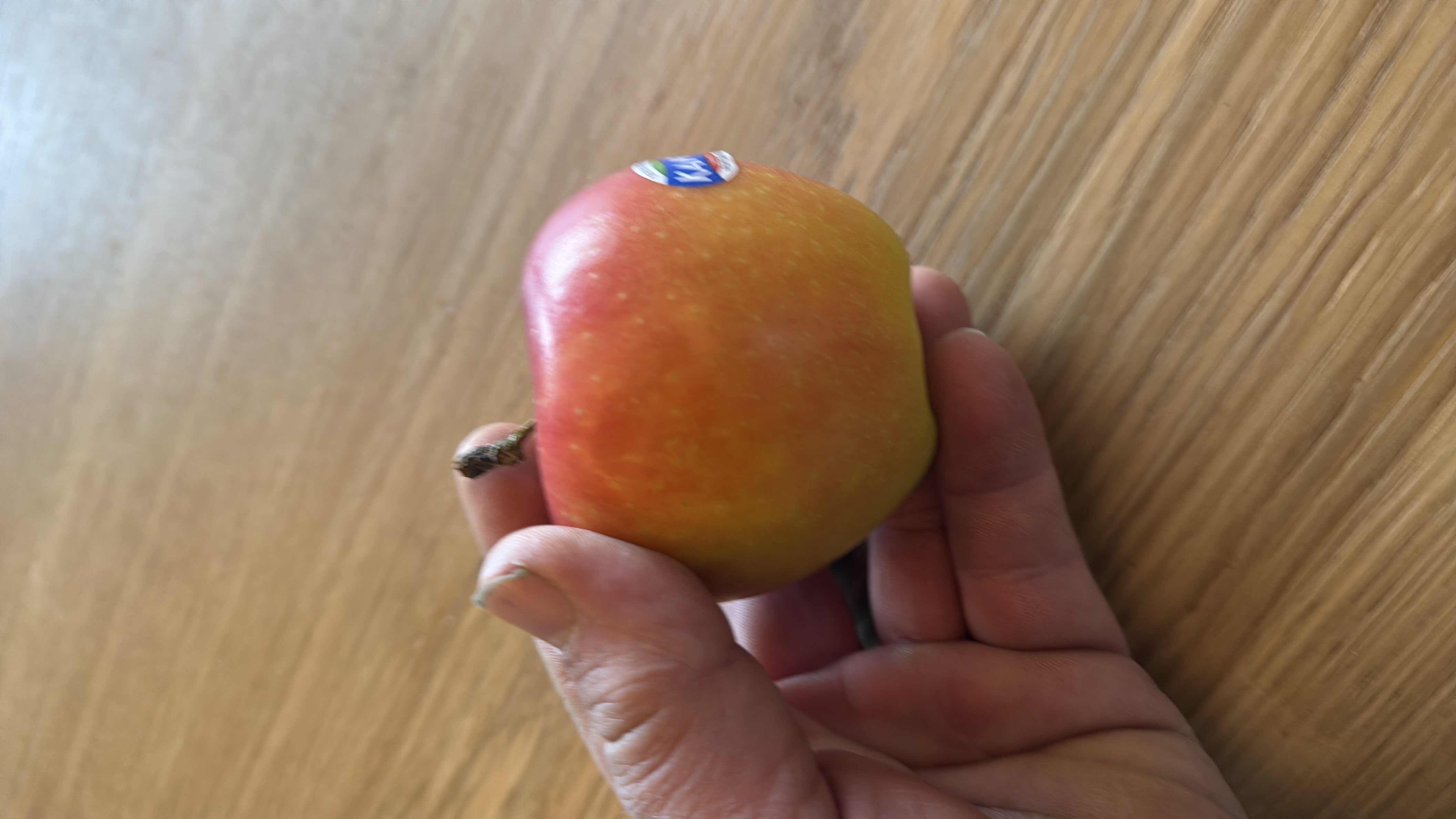 The image shows a fresh apple, which is a nutritious fruit low in calories and fats, and high in carbohydrates.