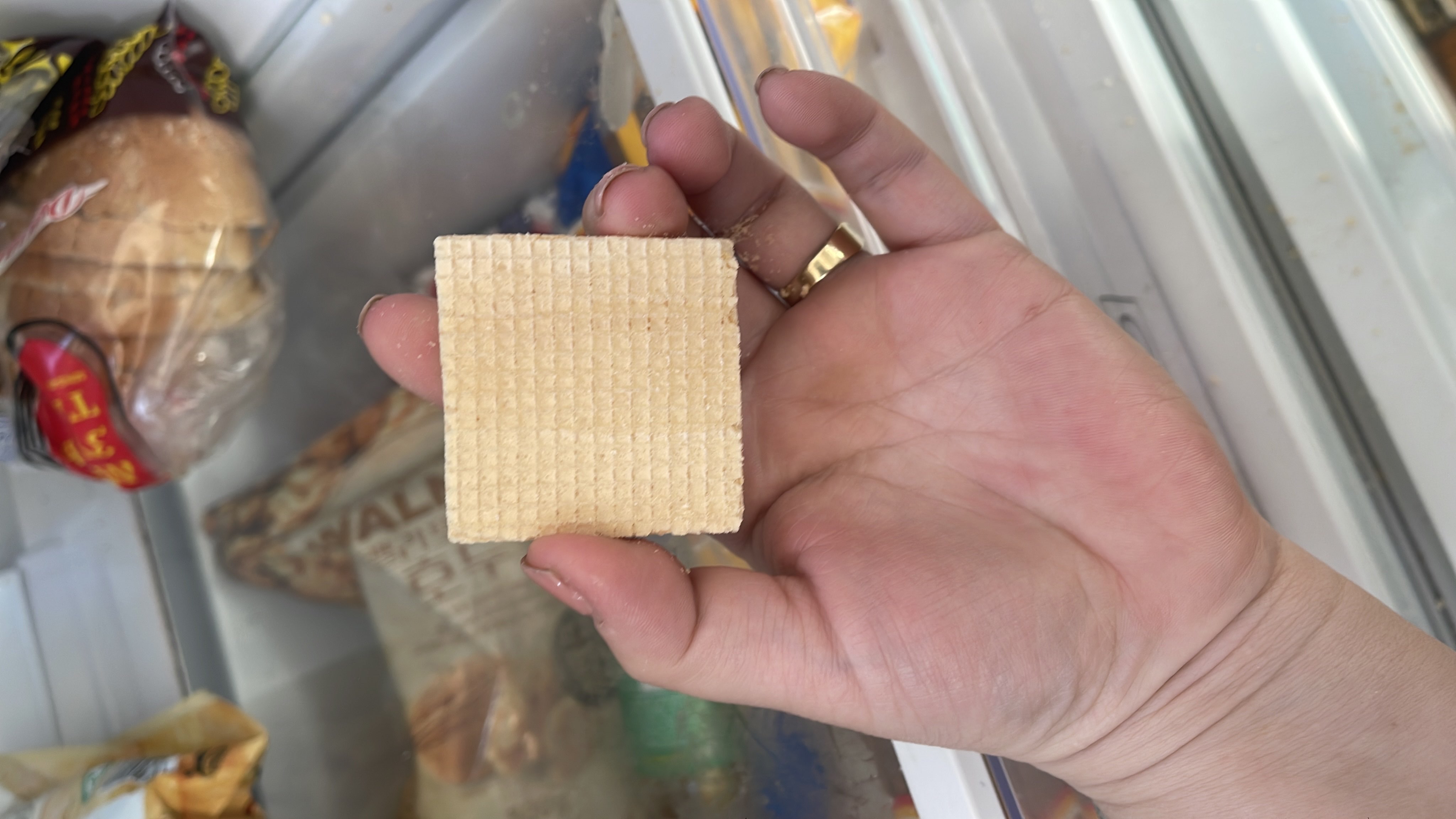 A single wafer snack, likely sweet, with moderate calorie content and a balance of carbs and fats.