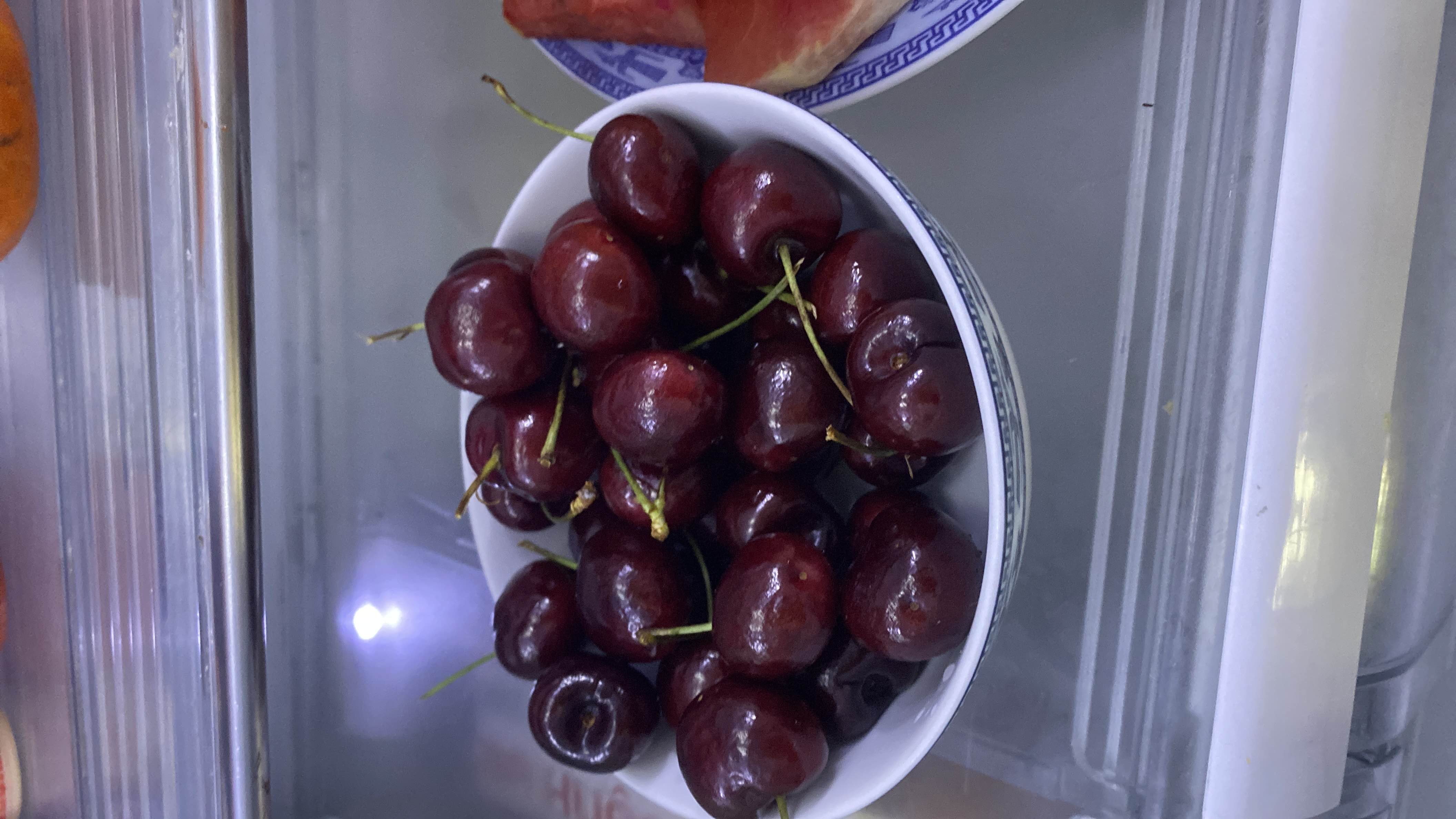 A bowl of fresh cherries, a low-calorie fruit rich in vitamins and antioxidants.