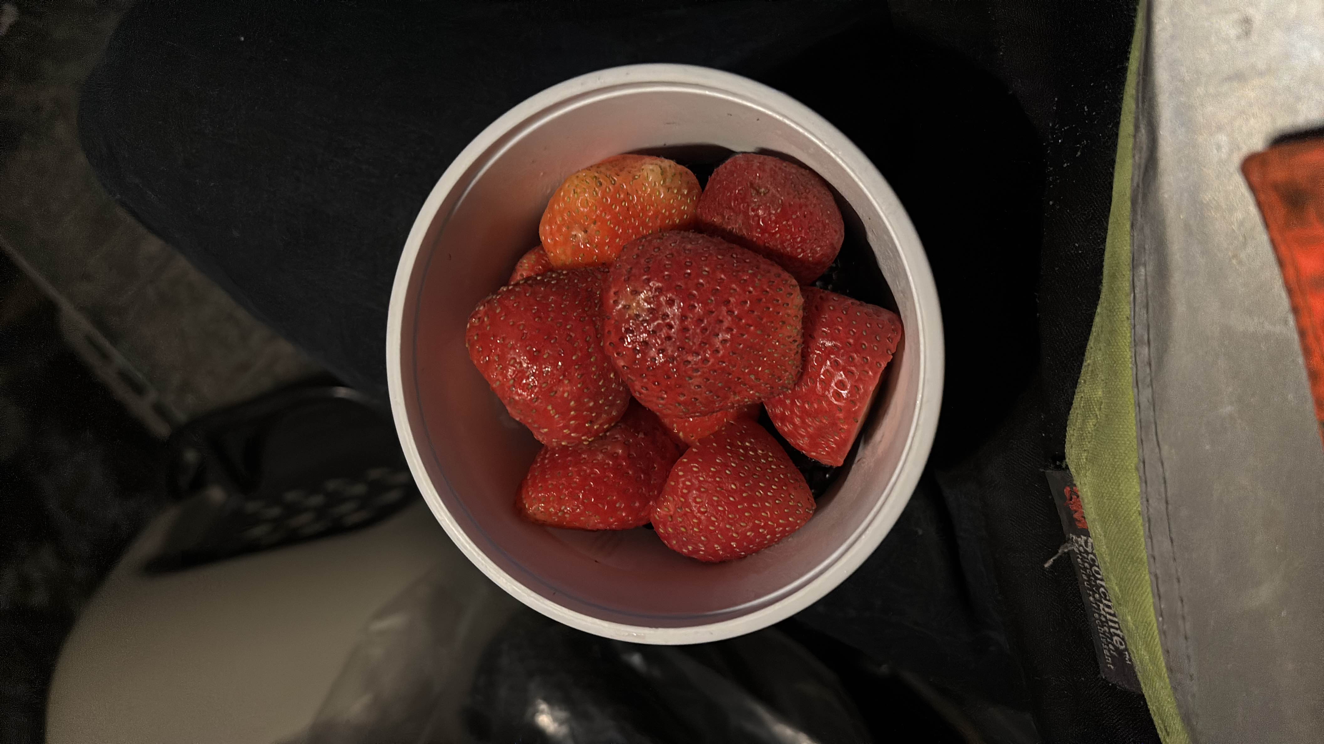 A bowl of fresh strawberries, a low-calorie and nutrient-rich fruit.