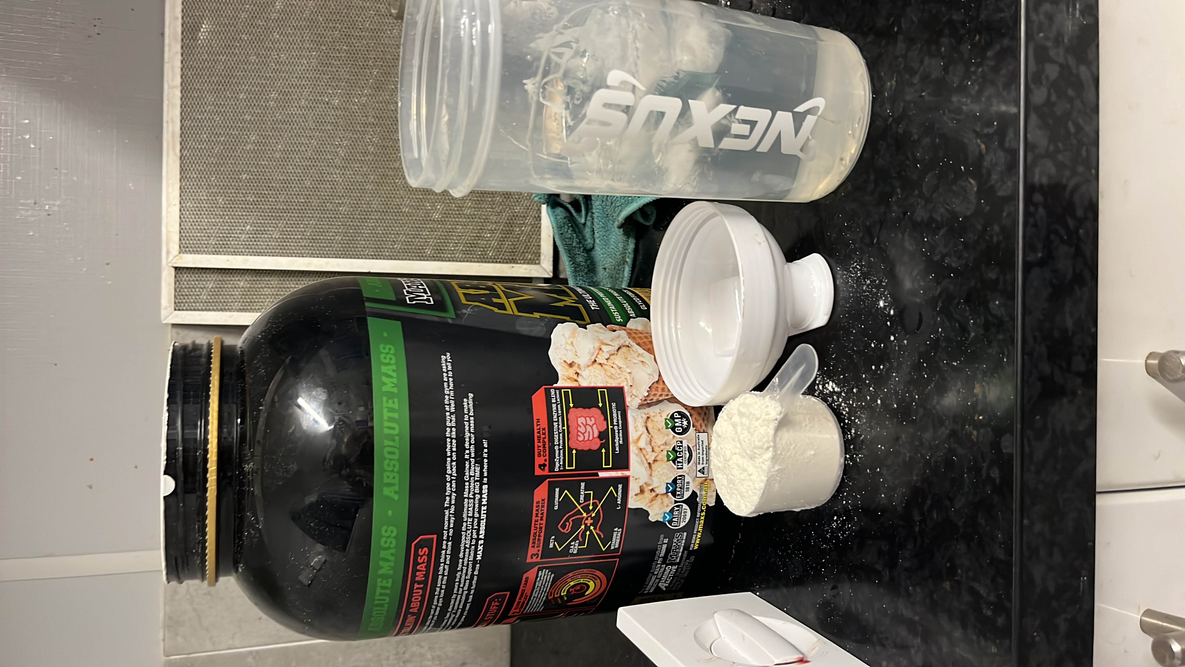 A high-calorie mass gainer protein powder designed for muscle building, featuring a blend of protein, carbohydrates, and minimal fats.