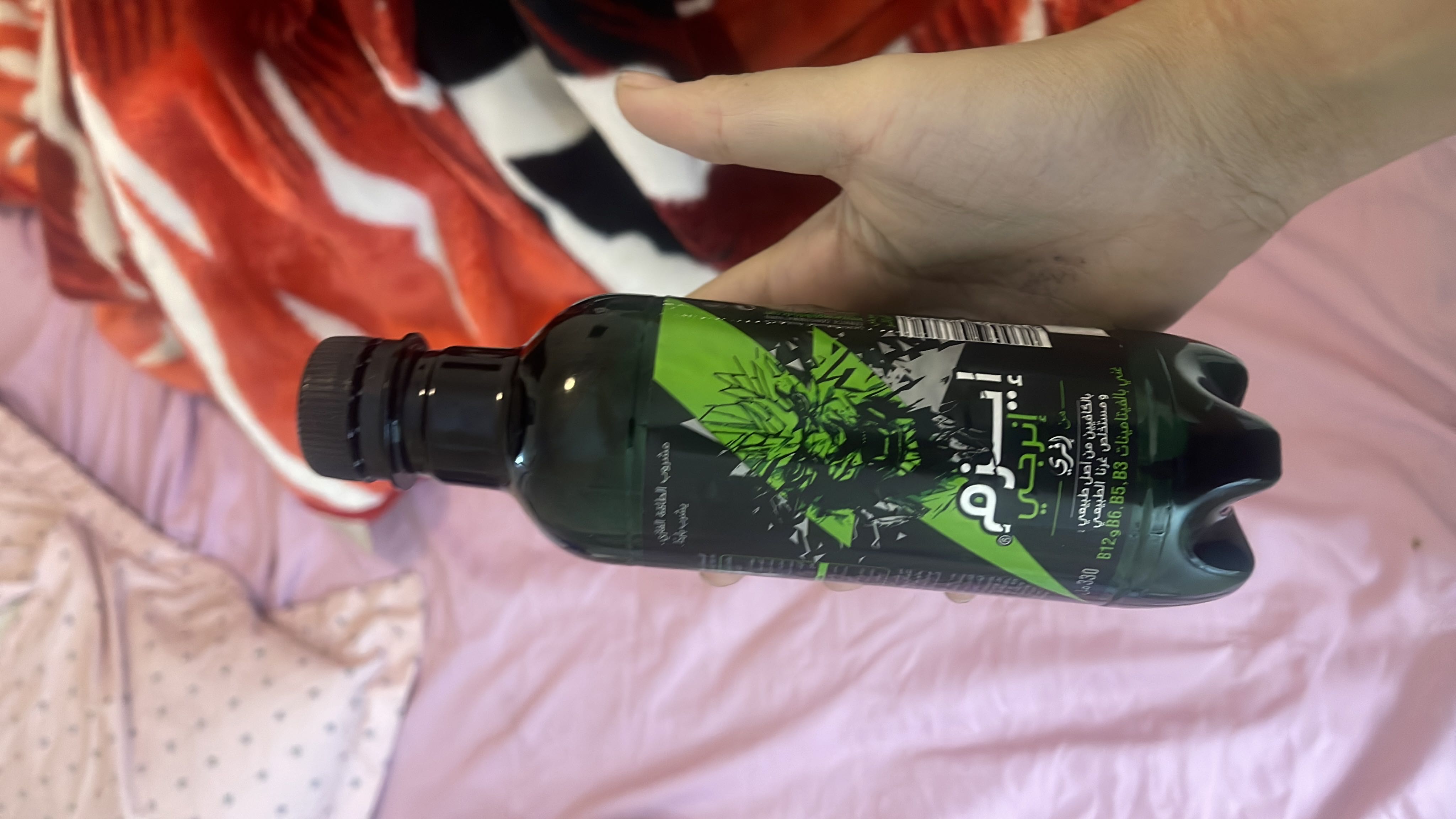 This is a green energy drink containing natural caffeine and vitamins B3, B5, and B6, with no significant caloric content.