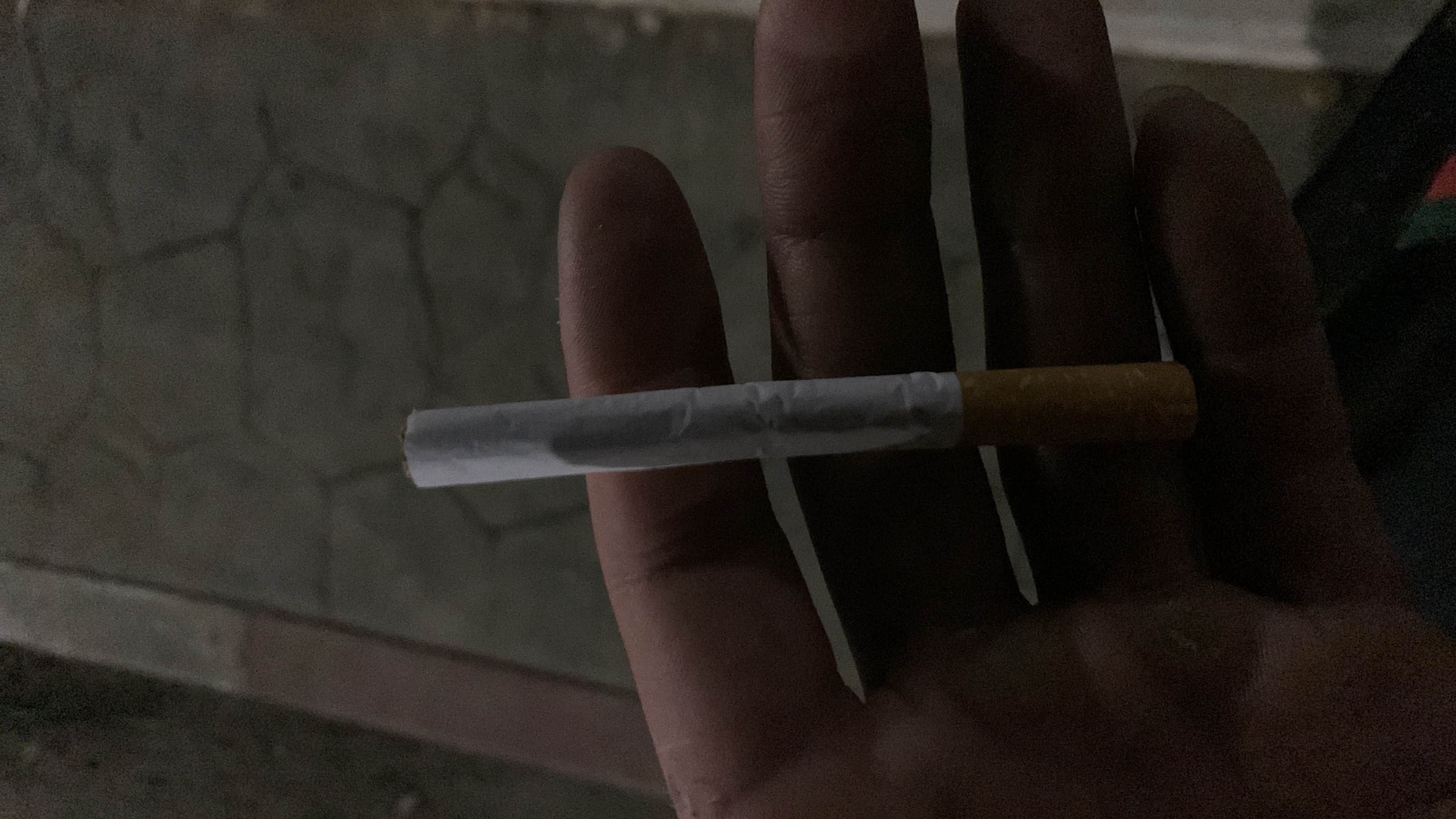 The image depicts a cigarette, which has no nutritional value and is harmful to health.